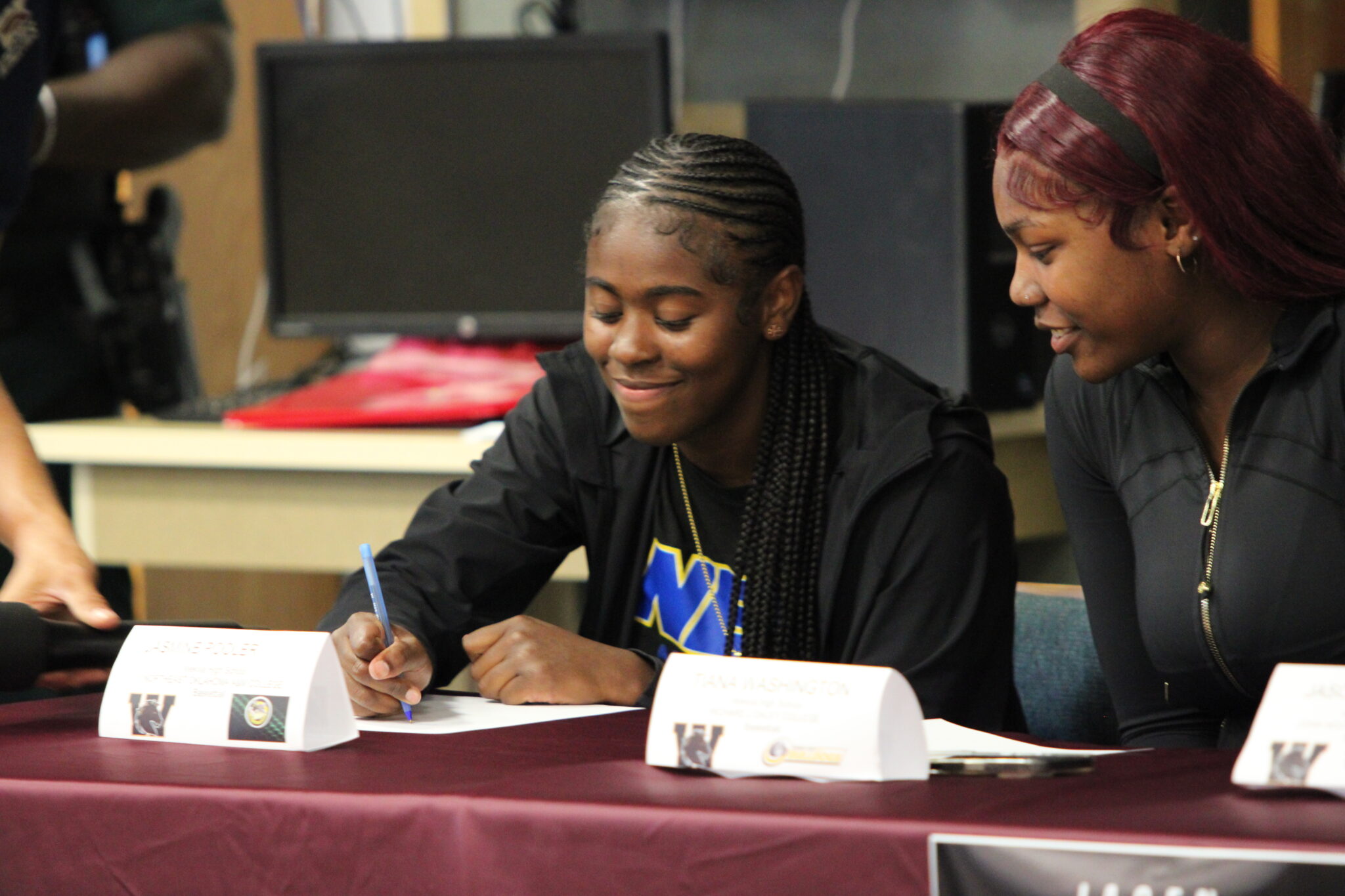 Jasmine Pooler signs her letter of intent to continue her academics and basketball career at Northeastern Oklahoma A&M