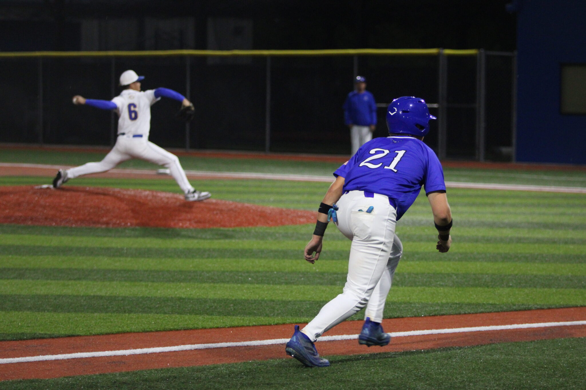Jez Hamrick leads off of third base
