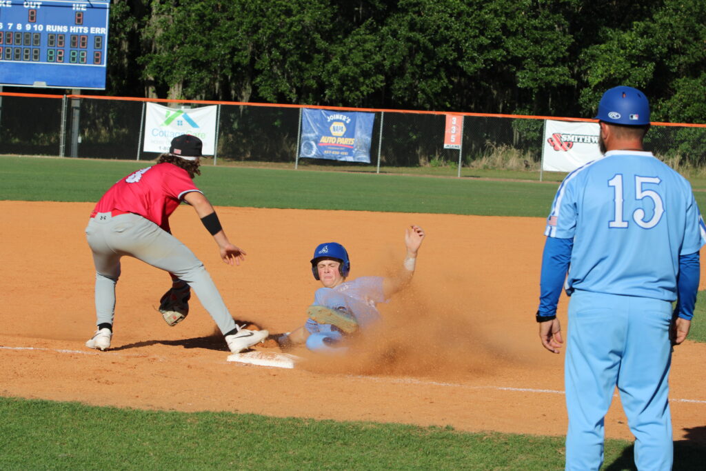 Jez Hamrick slides in safely to third base in the seventh inning against Lake Mary