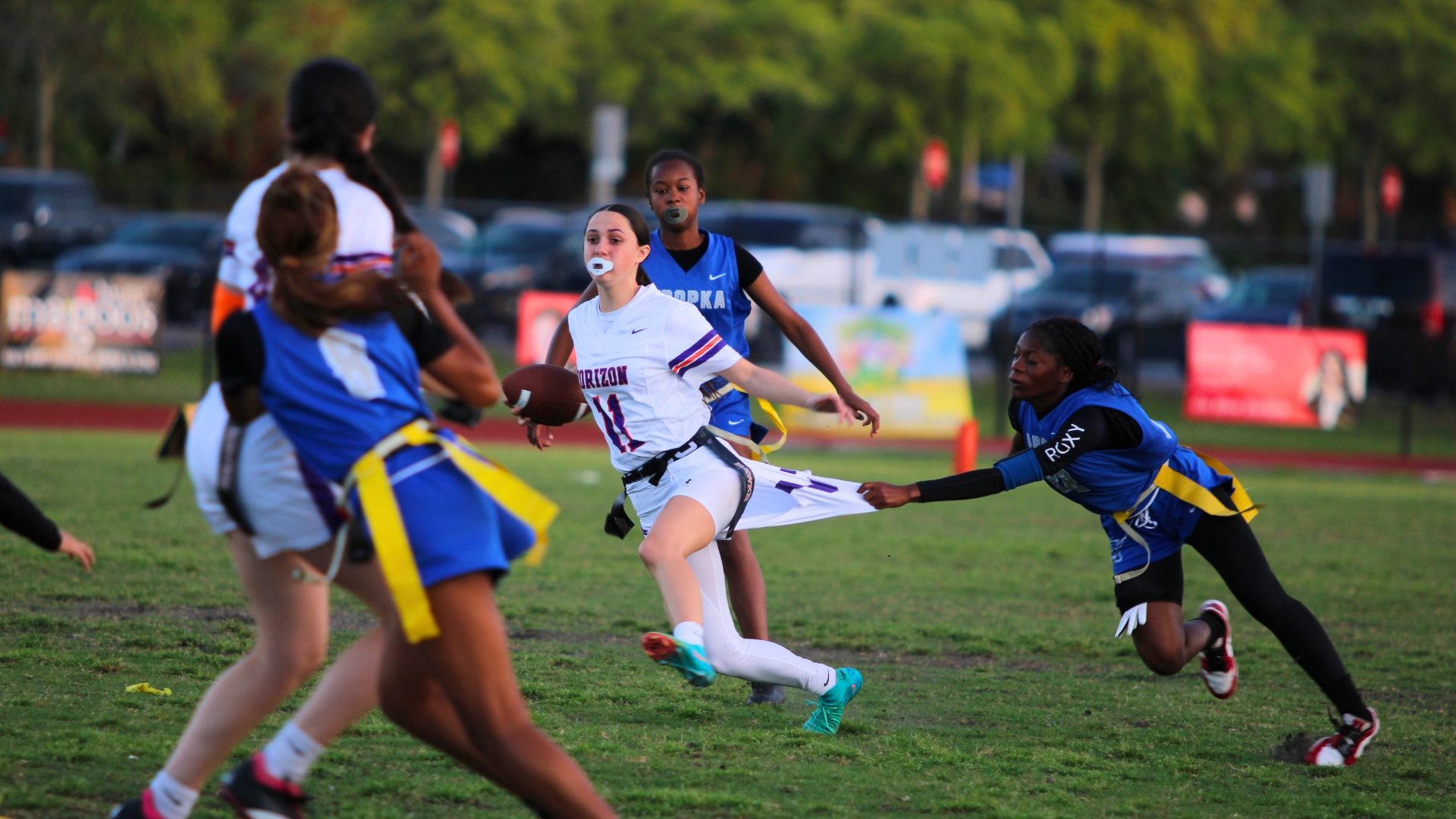 Kamaya Johnson grabs a handful of shorts in attempt for the flags