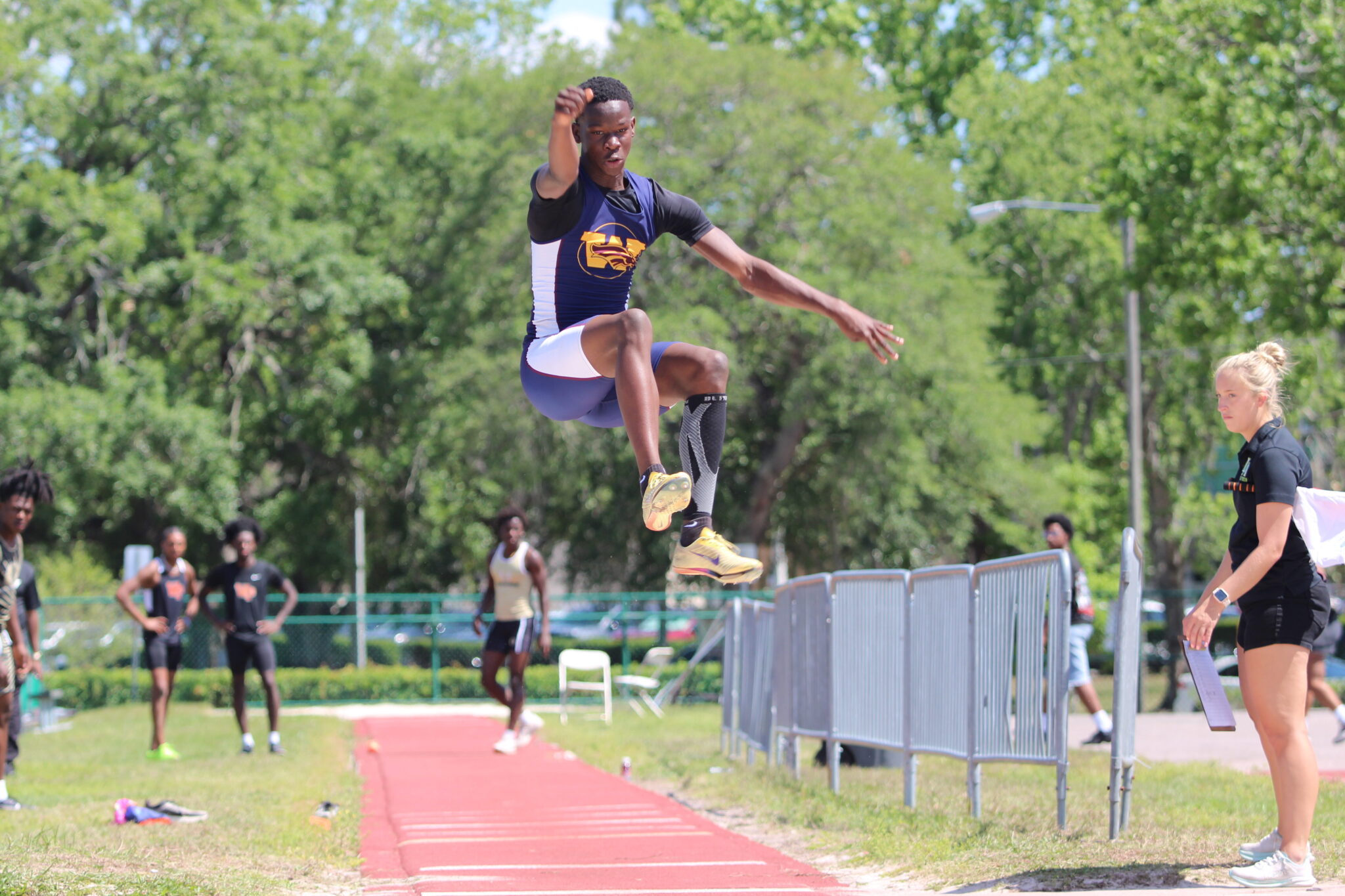 Kimbilly Esteral leaps forward on a long jump attempt, finishes top 8