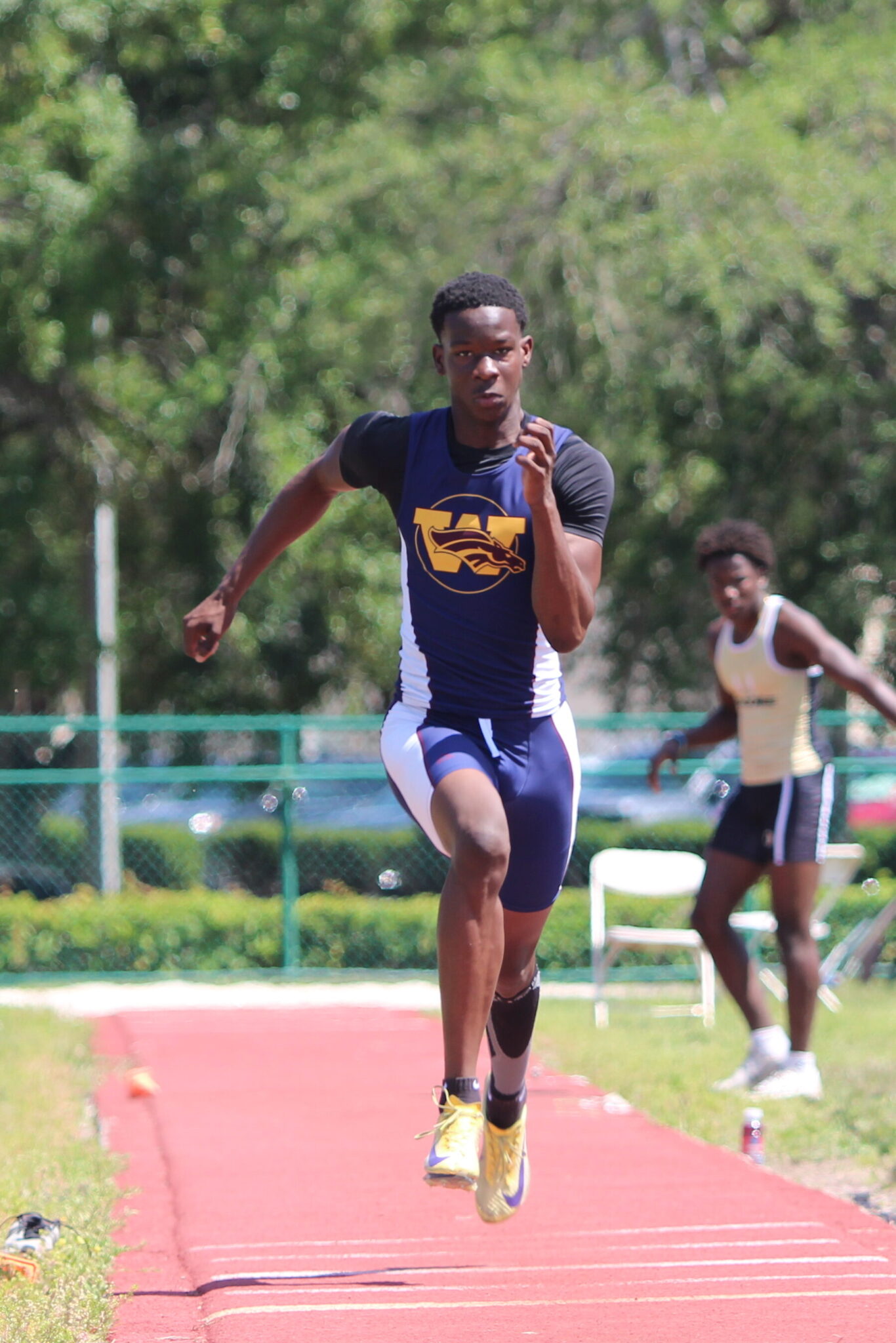 Kimbilly Esteril runs up the long jump lane, places top 8 in long jump and top 5 in the high jump