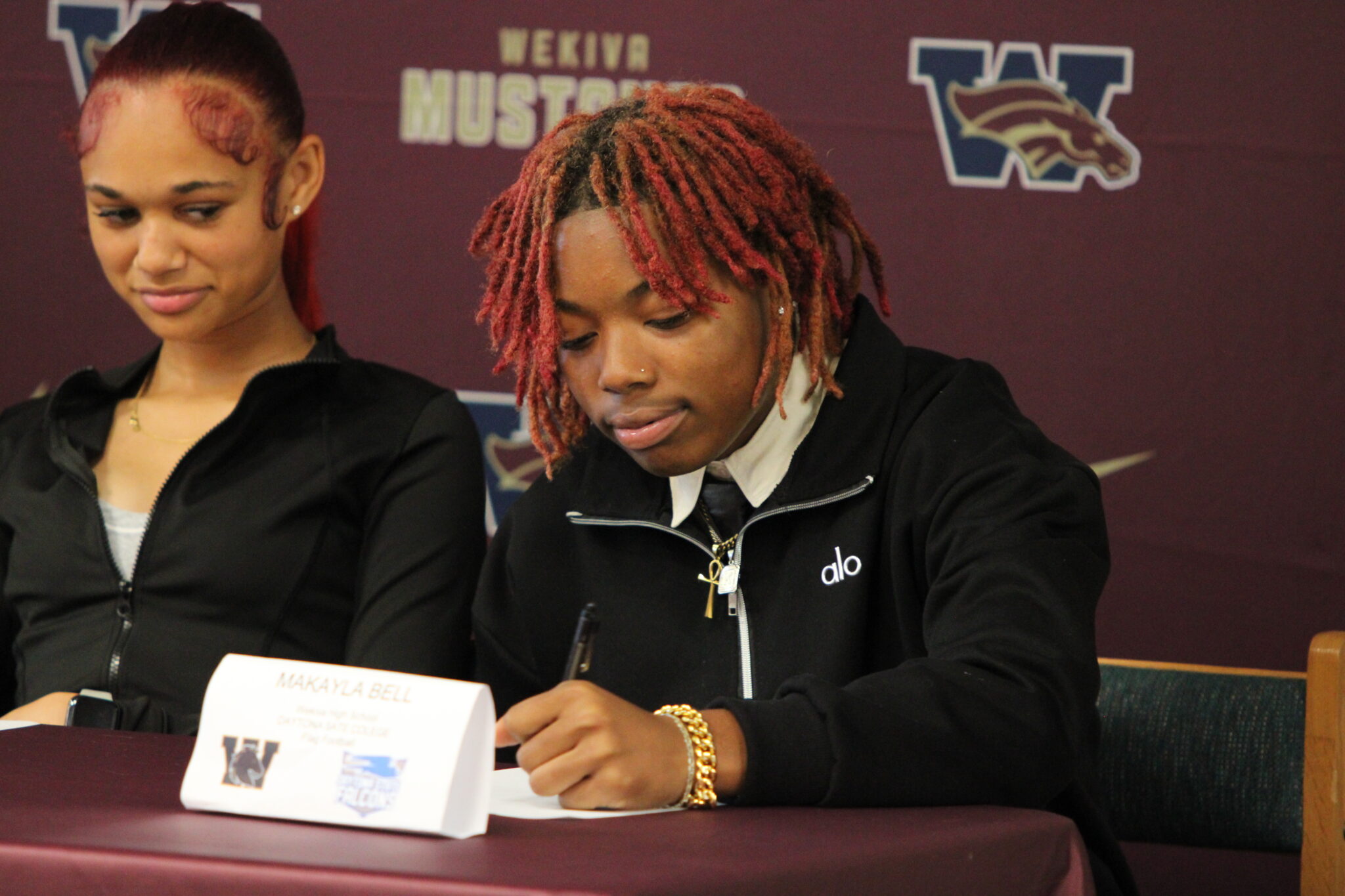 Makayla Bell signs her letter of intent to continue her academics and flag football career at Daytona State