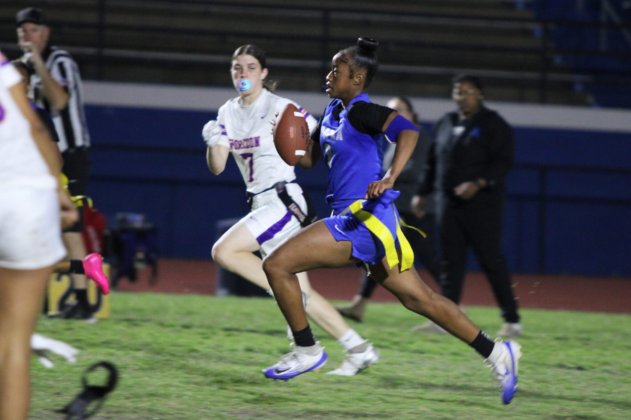 Mikayla Wiggins intercepts a pass and hustles straight through defenders to the endzone