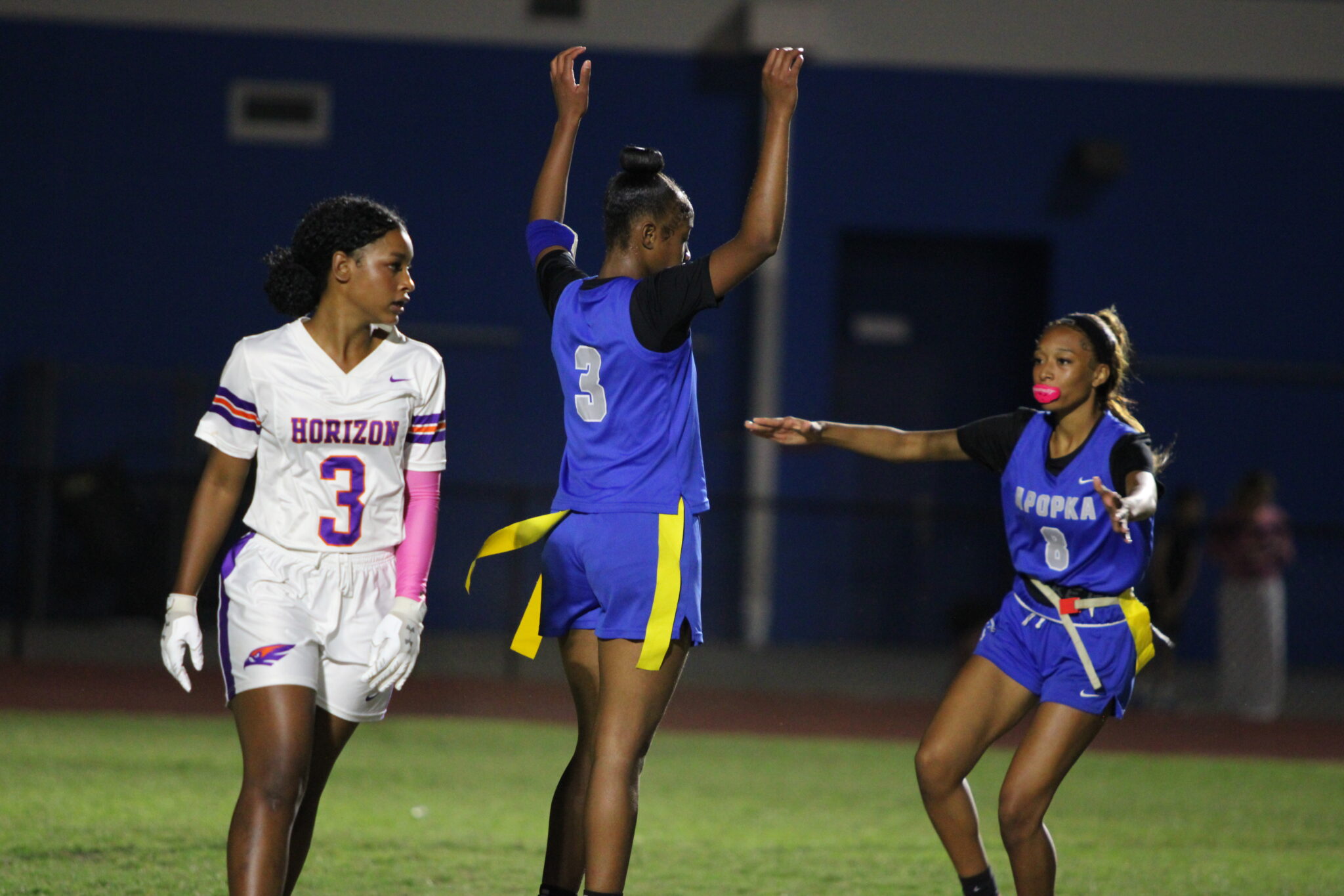 Mikayla Wiggins scores the first touchdown for the Darters as Paeton Oliphant comes to rip off her flags to celebrate