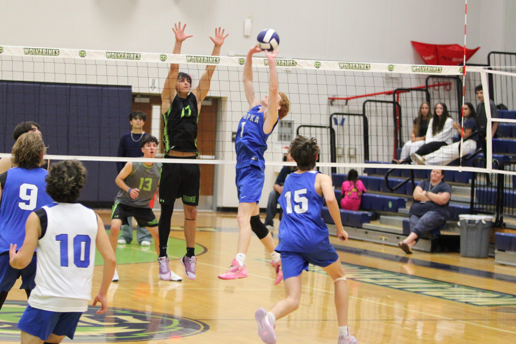 Nathan White sets a ball over his head for Ian Cottman to fly in and kill for the game winning point