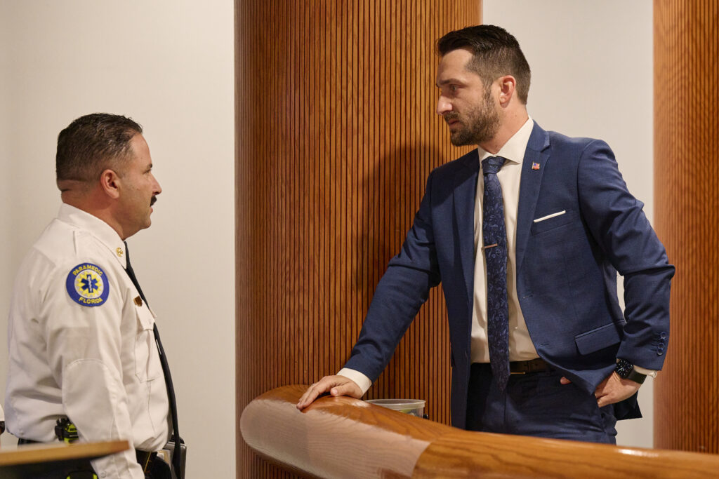 City Commissioner Nick Nesta (R) speaks with Apopka Fire Chief Wil Sanchez on April 1.