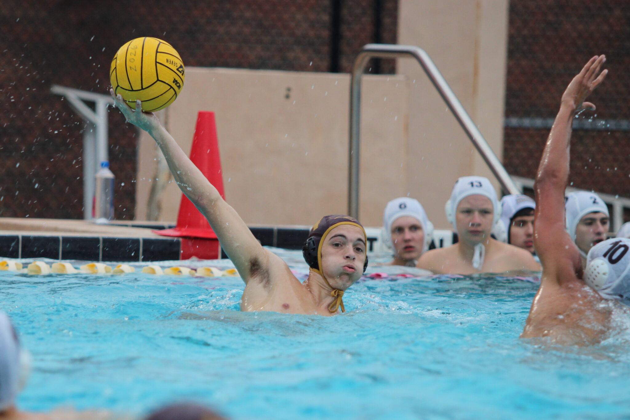 Nicholas Woodward pump fakes a shot, looks across the pool for Cameron Parry