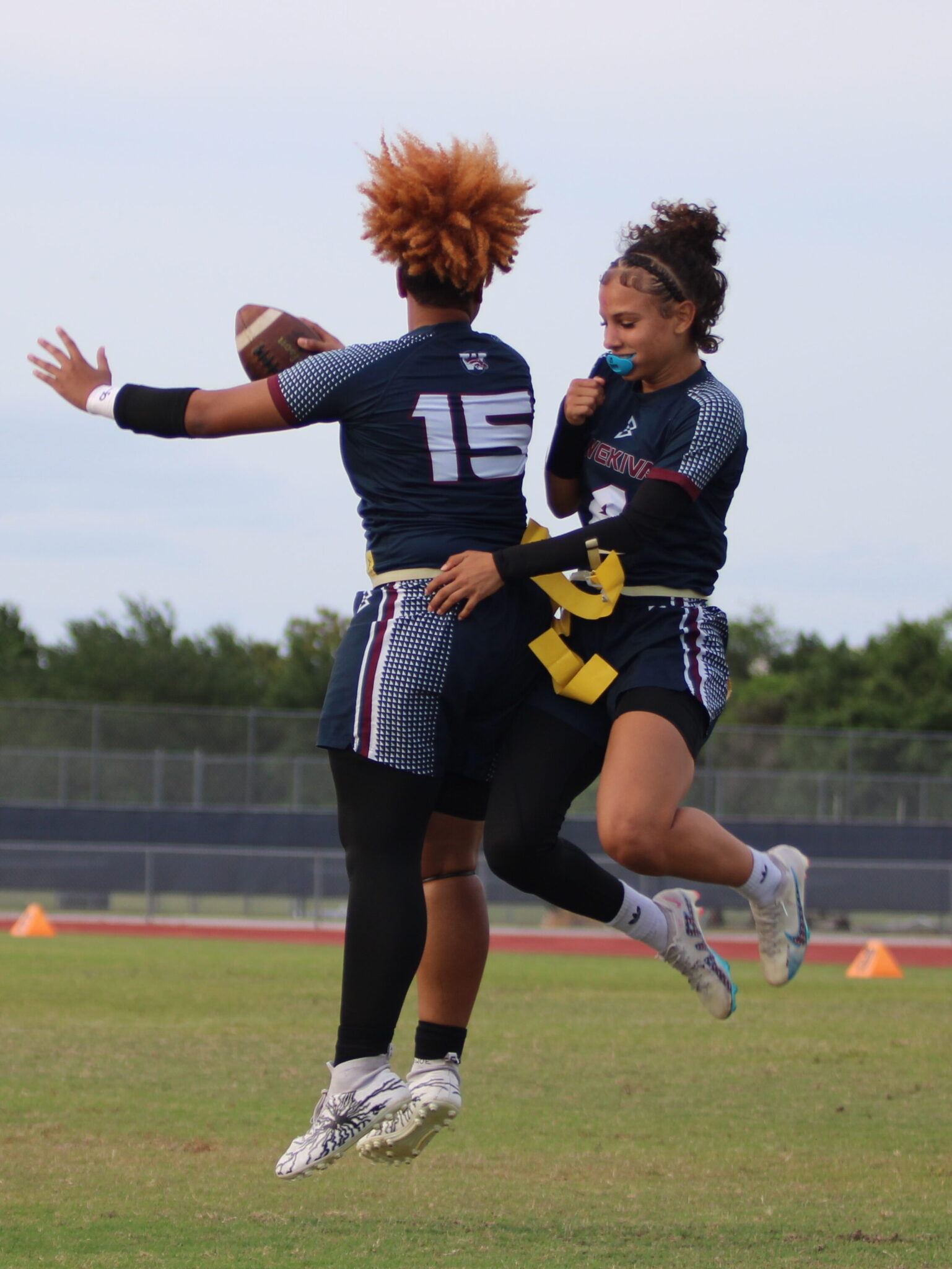 Paris Blackwood and Kiamora Antrum meet in midair to celebrate their touchdown connection late in the game