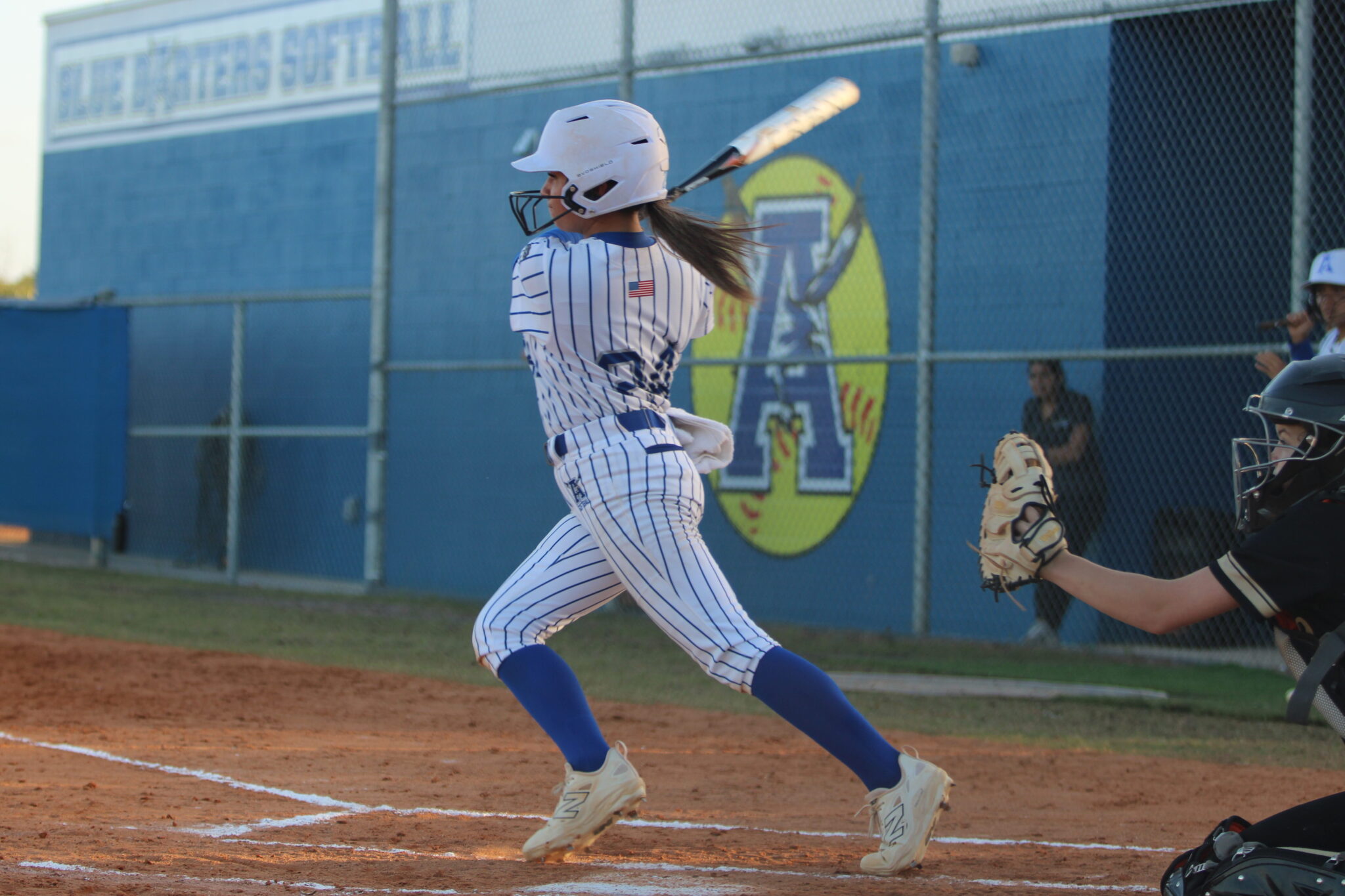 Shylah Pino drills her first at bat into the outfield
