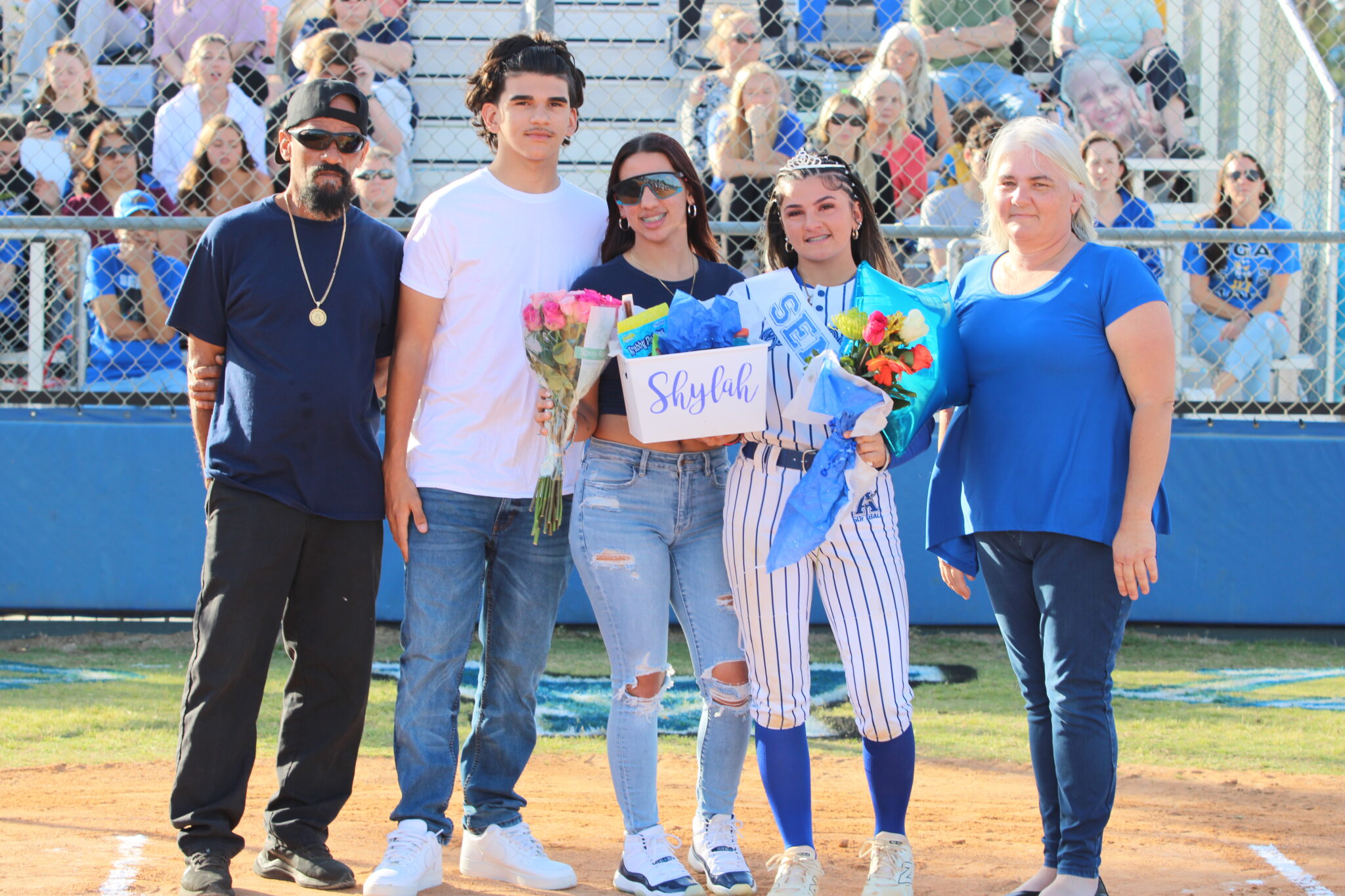 Shylah Pino poses with her family on senior night
