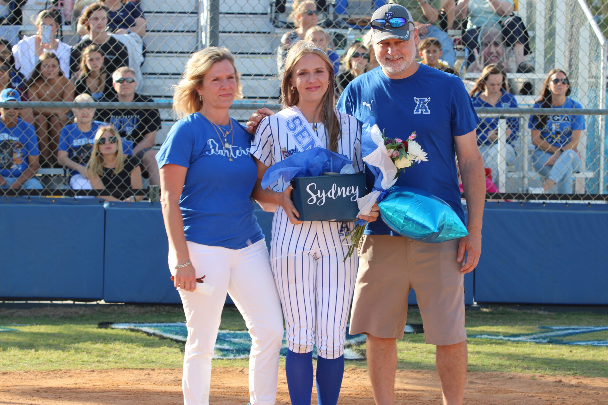 Sydney Bartkin poses with her family on senior night