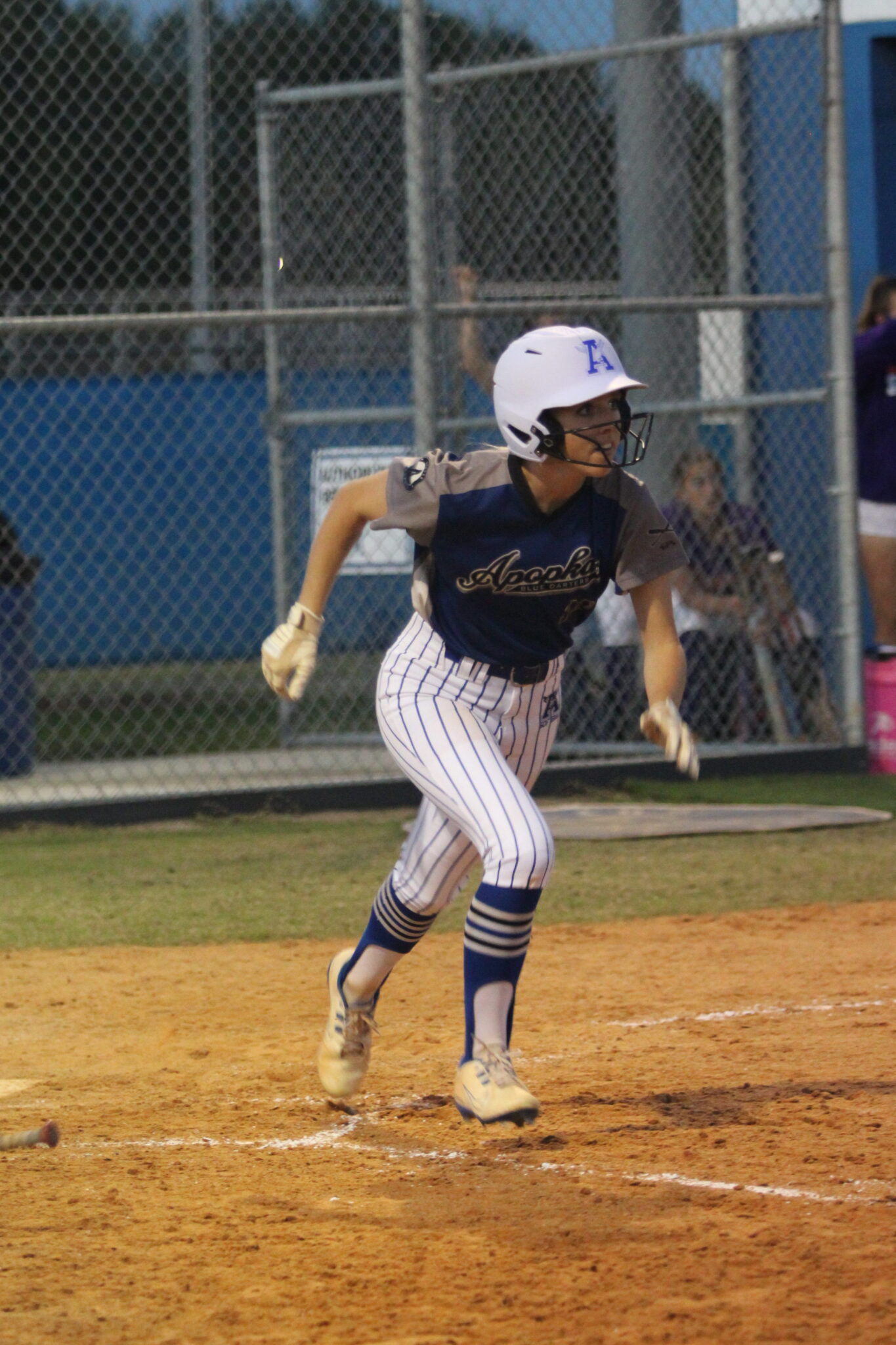 Sydney Bartkin takes off running down the first base line after her hit to the outfield