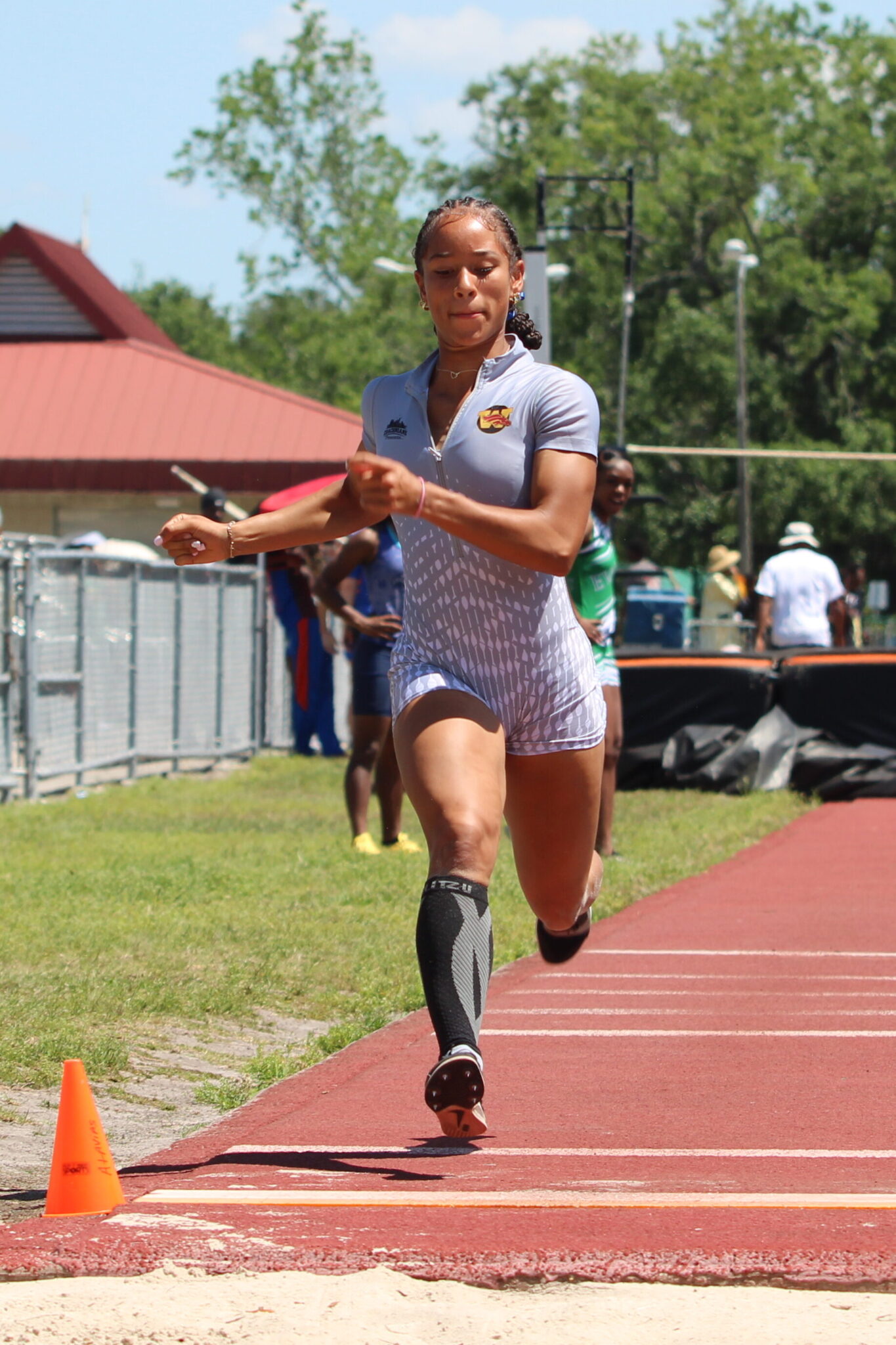 Tamea Foster prepares to full send a jump after her full sprint up the lane