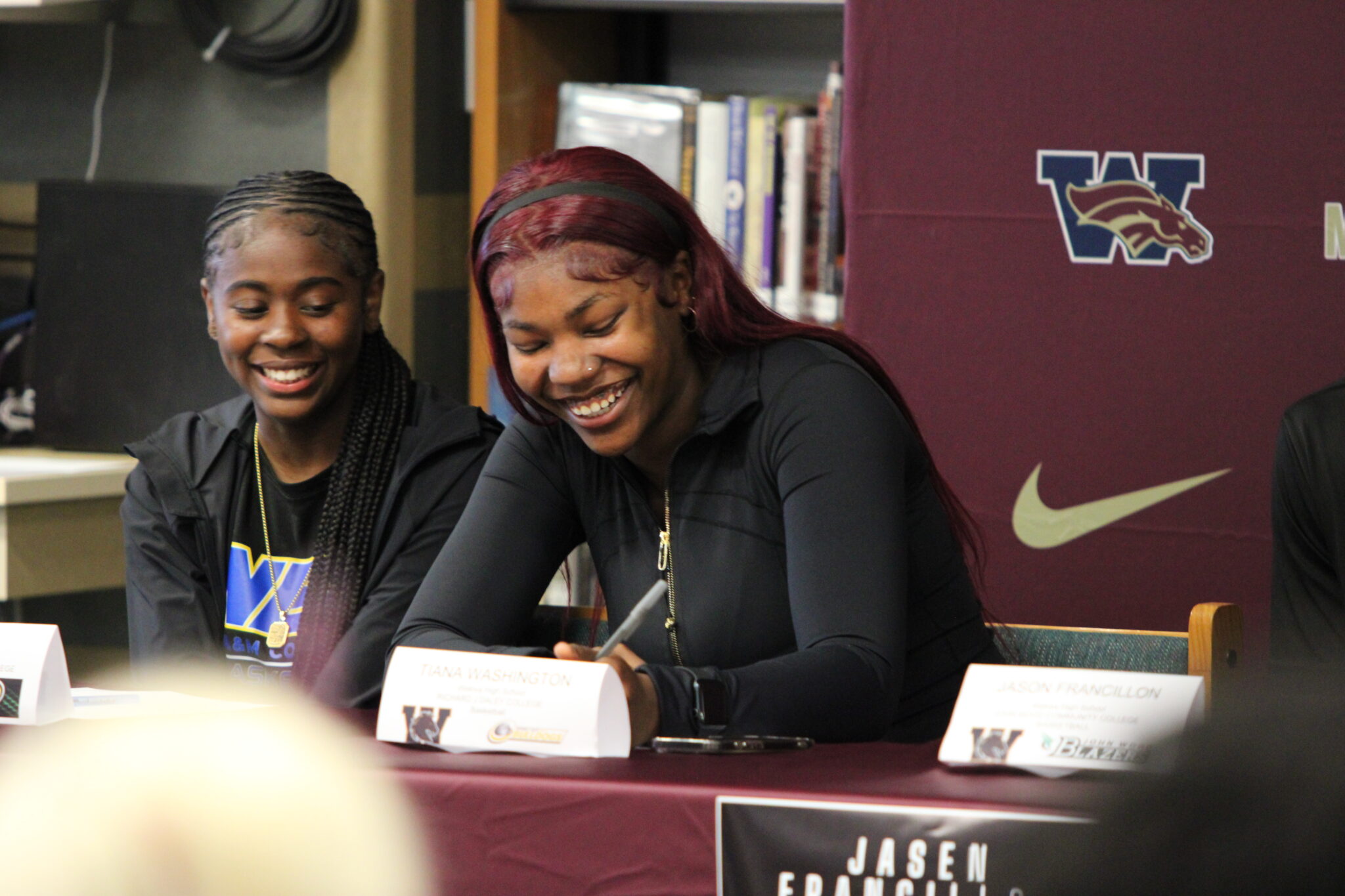 Tiana Washington signs her letter of intent to continue her academics and basketball career at Richard Daley College