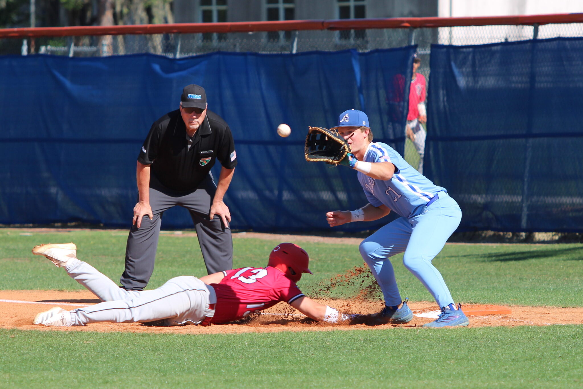 Tyler Spaid attempts a pickoff throw to Jez Hamrick at first base