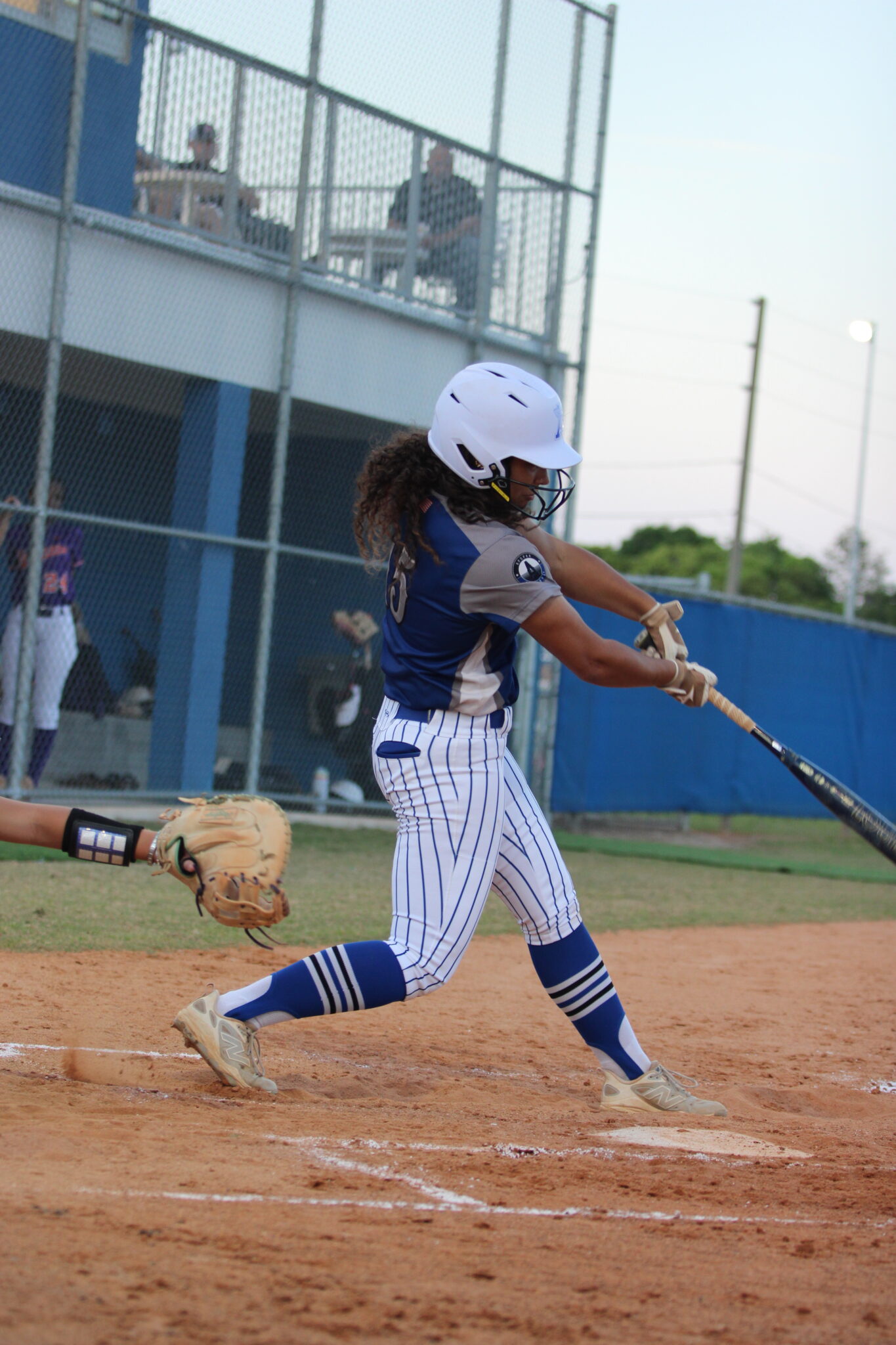 Victoria Shaw drives a ball to the fence to bring home a runner