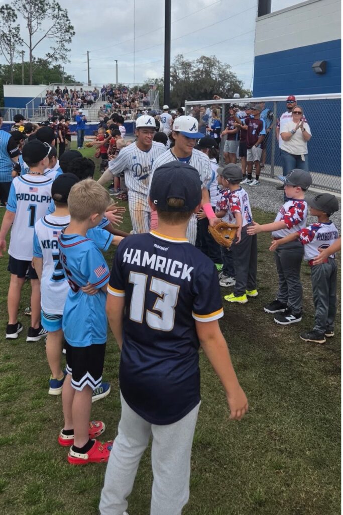 Dozens of Little Leaguers greeted Blue Darters during pregame introductions.