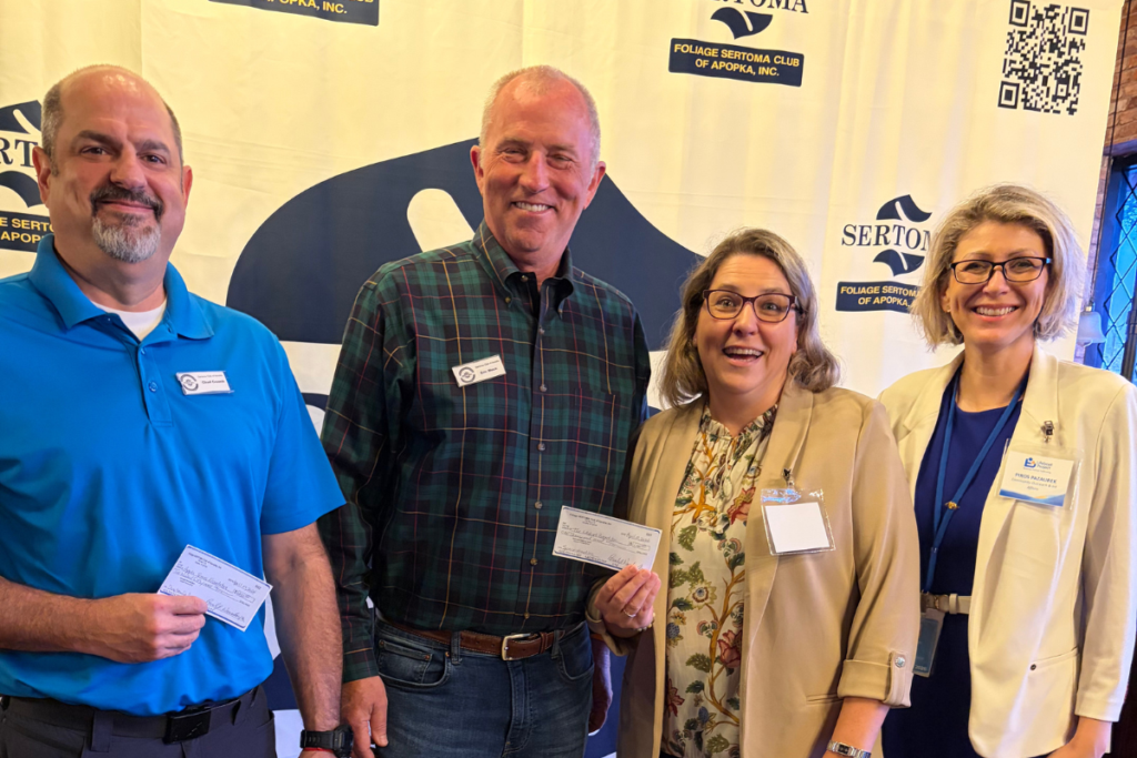 From left to right: Chad Creech from the Apopka Serves Foundation, Foliage Sertoma Club of Apopka president Eric Mock, The Lifeboat Project's Emese Asztalos, and Piros Pazaurek of The Lifeboat Project.