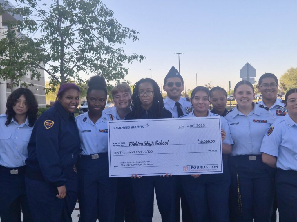 Wekiva High School JROTC students pose with the $10K check at the March 23 Military Recruitment Day.