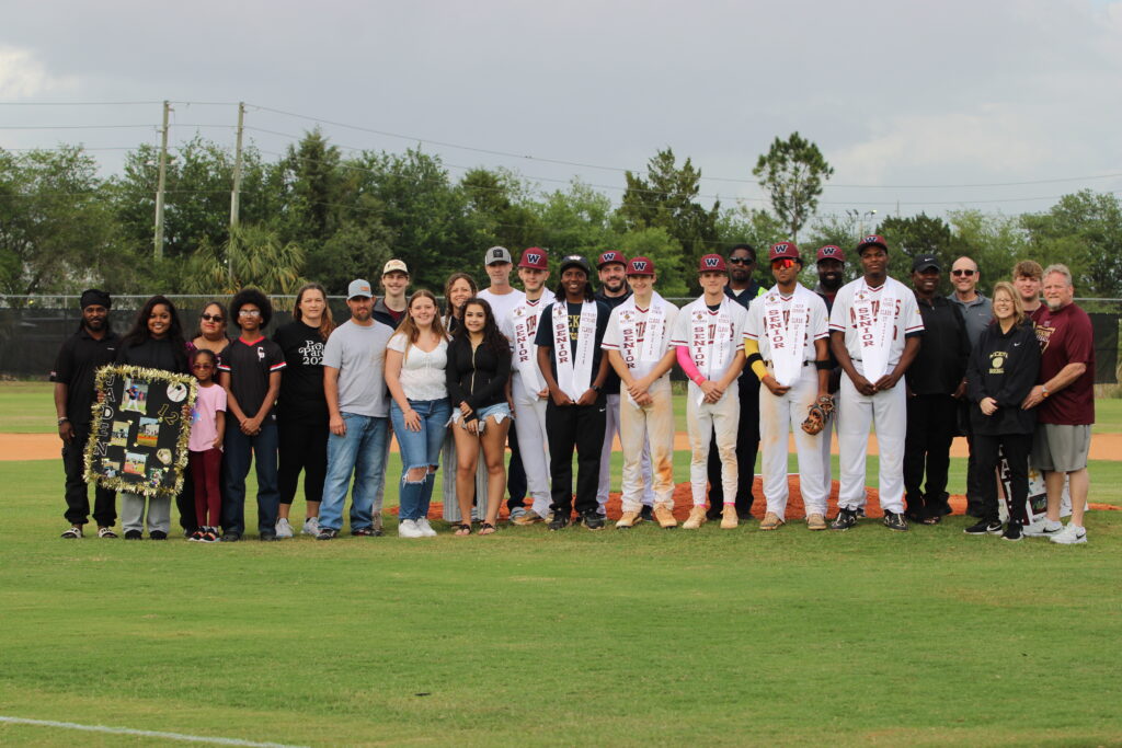 Wekiva Mustang seniors, coaches, and families group up for senior nightWekiva Mustang seniors, coaches, and families group up for senior night