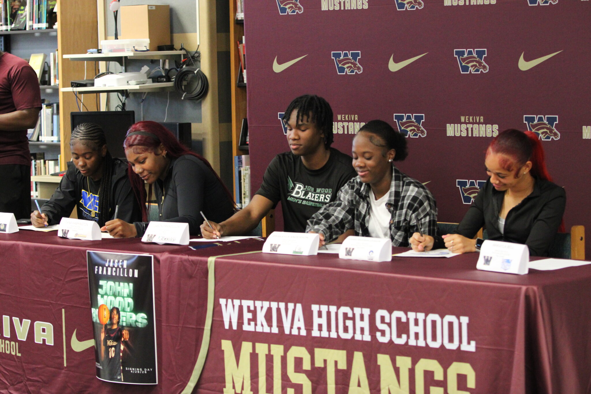 Wekiva basketball and flag football athletes sign their letters of intent to continue their academic and athletic careers at the collegiate level