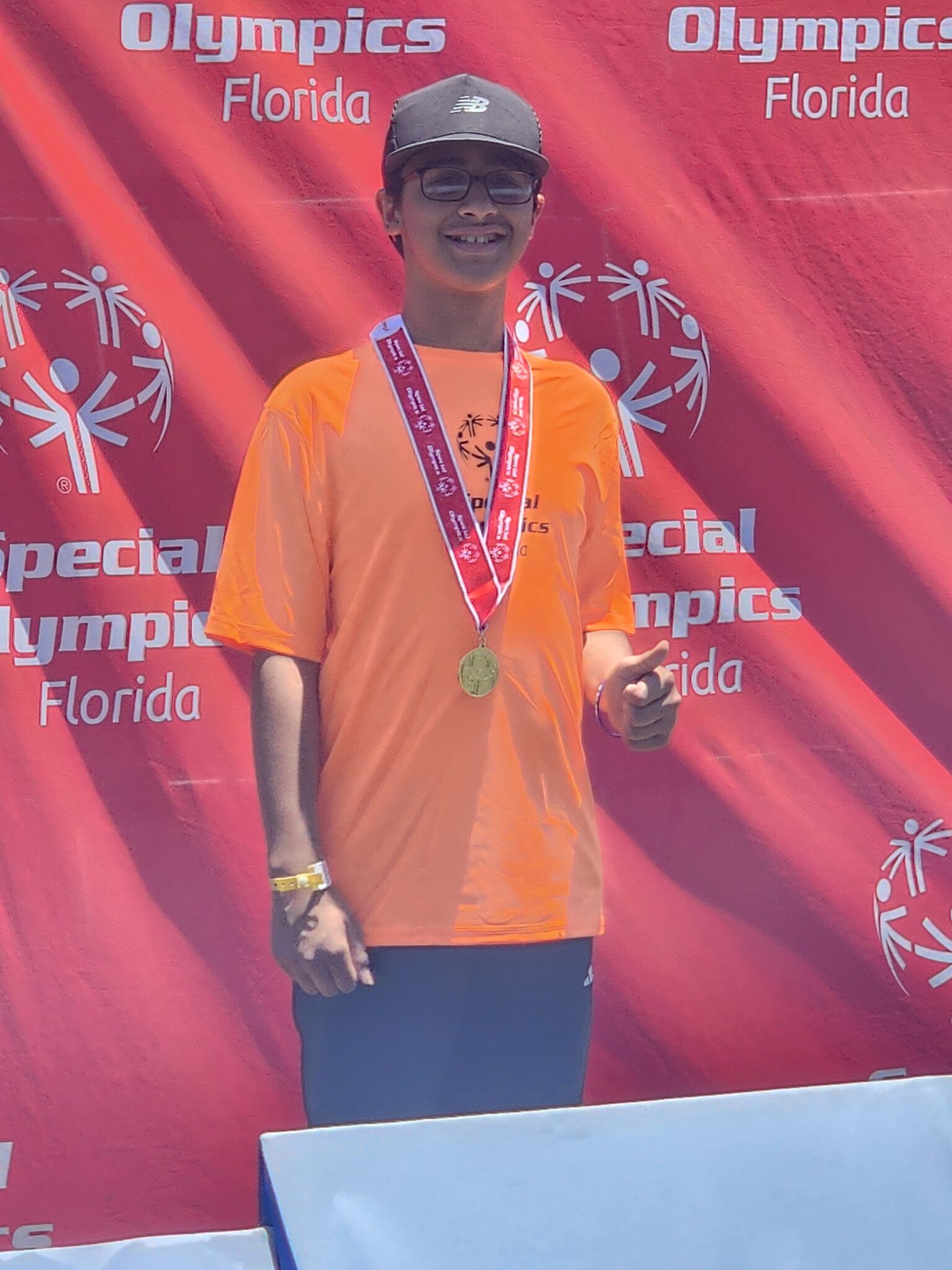 Umal Dones poses with his medal at the Special Olympics.