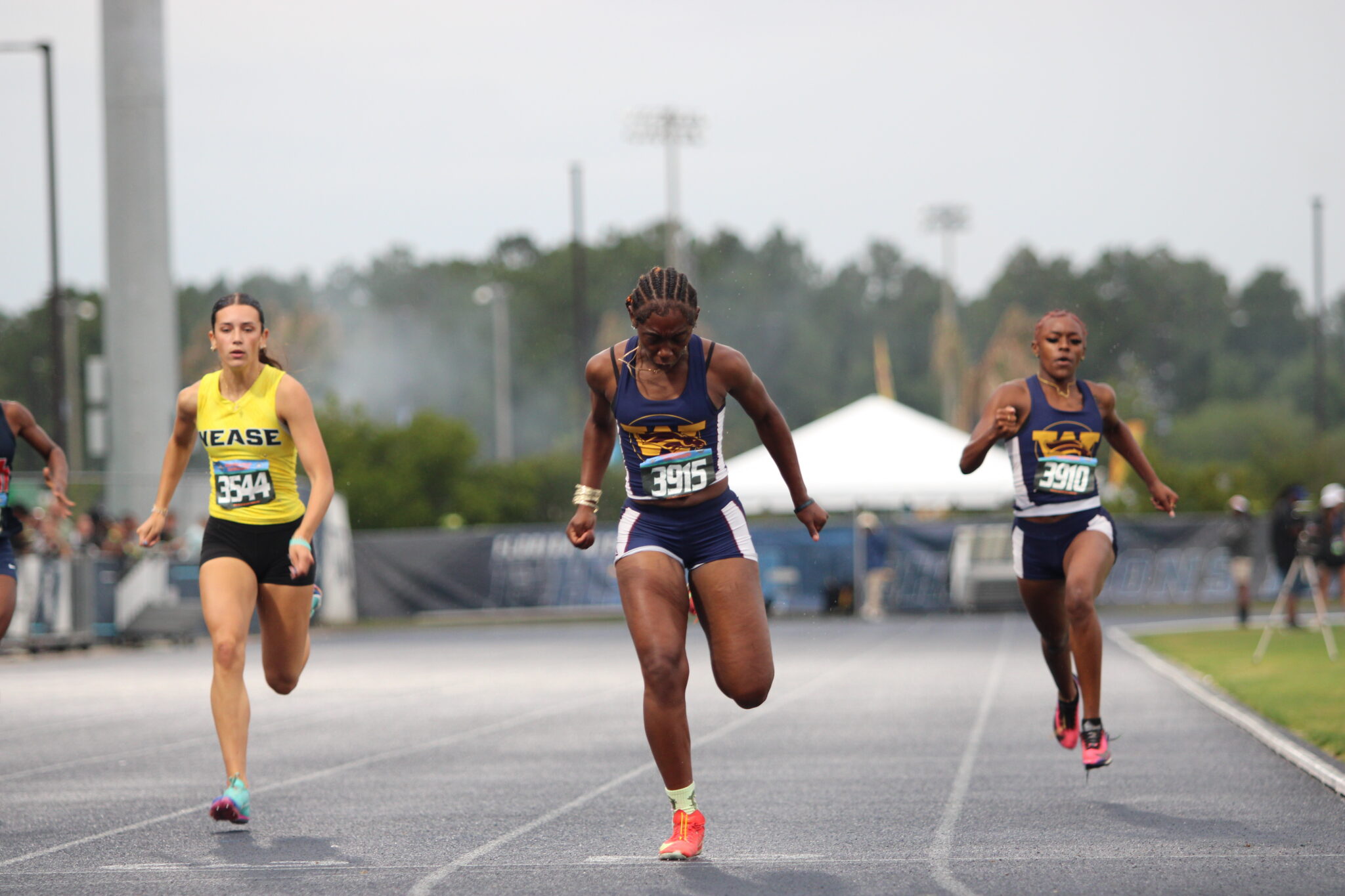 Akira Wise finishes third in her heat in the 200m race