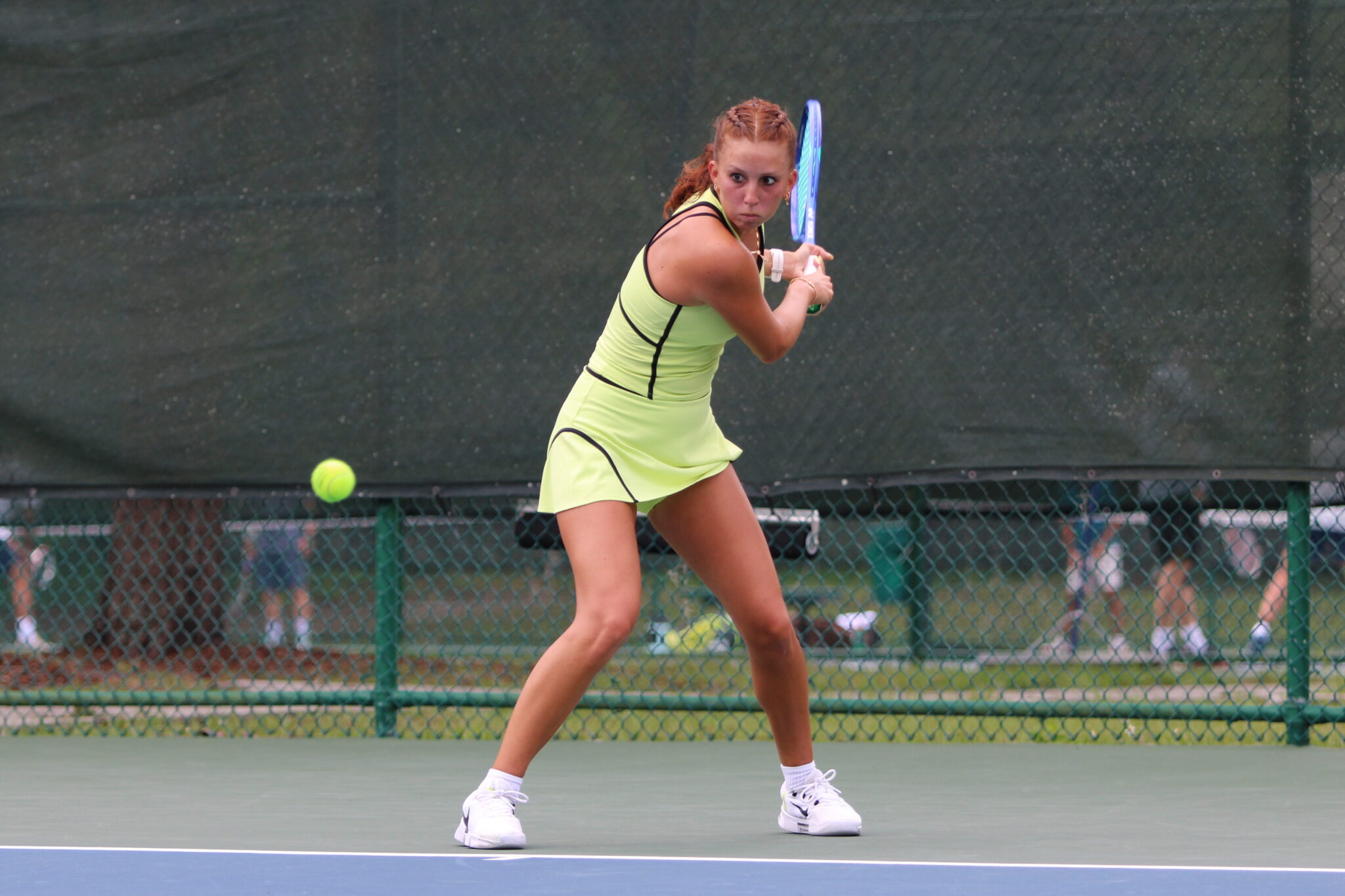 Alyssa Novoa laser focused on a backhand shot.