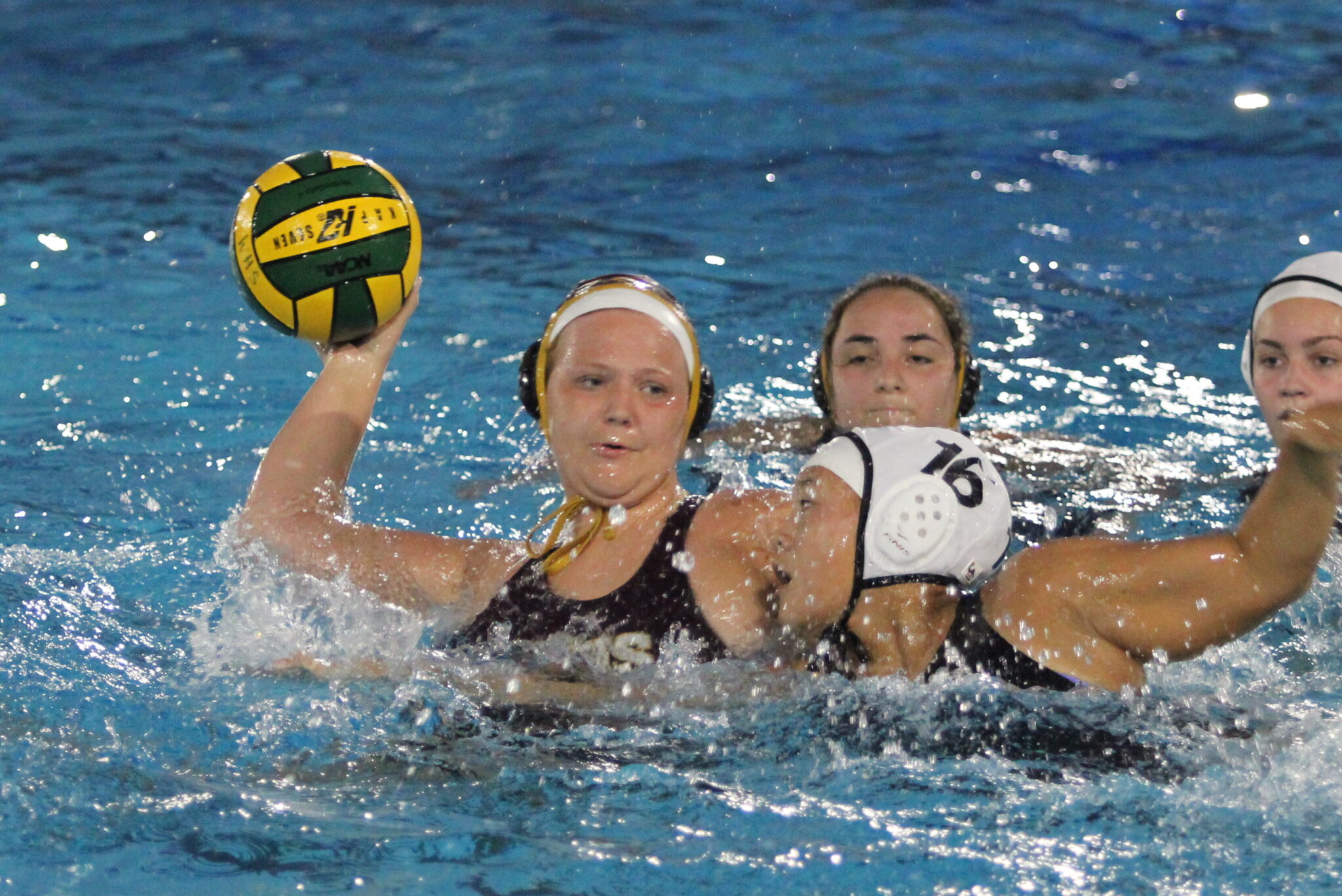 Avery MeGargee whips in a shot with the defender draped on her