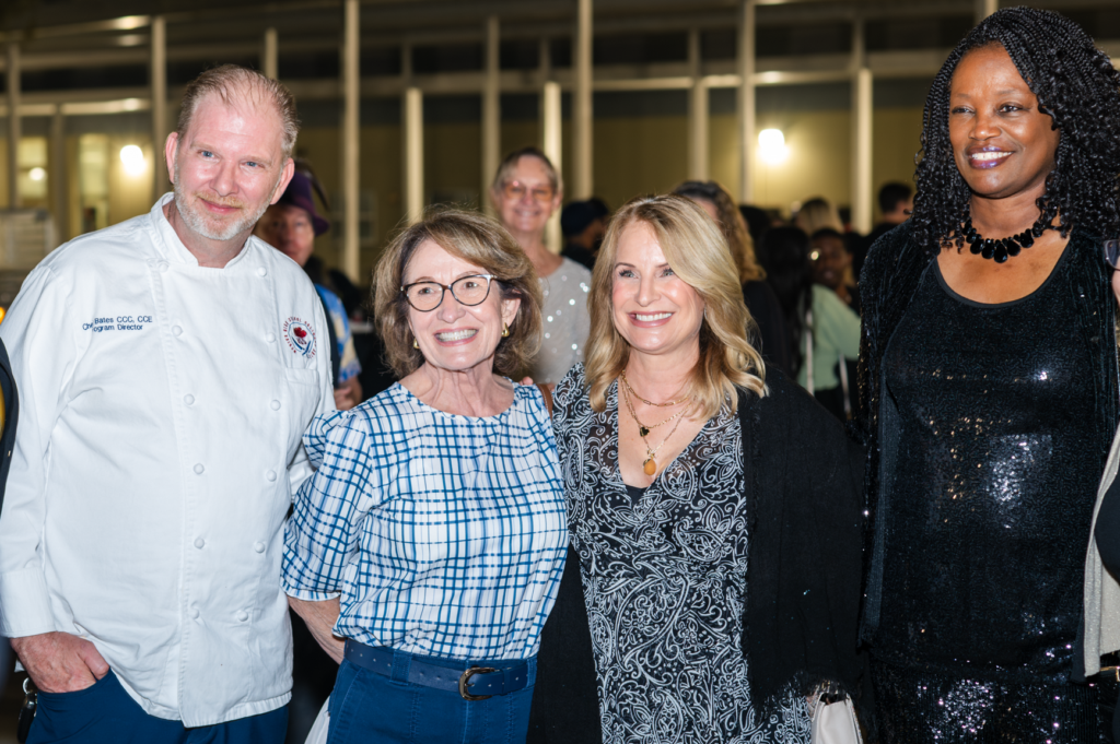 Christopher Bates (left) poses with guests at the March 3 Taste of Wekiva event at Wekiva High School.