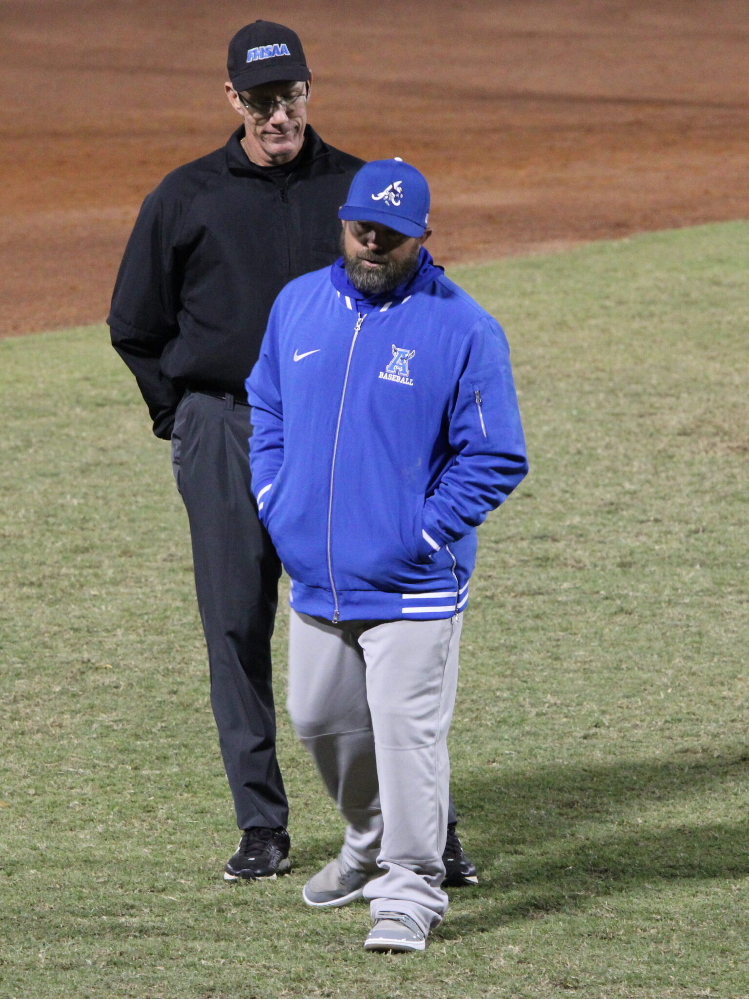 Coach Scott Garland talks to the umpire after a controversial call in an earlier game this season.