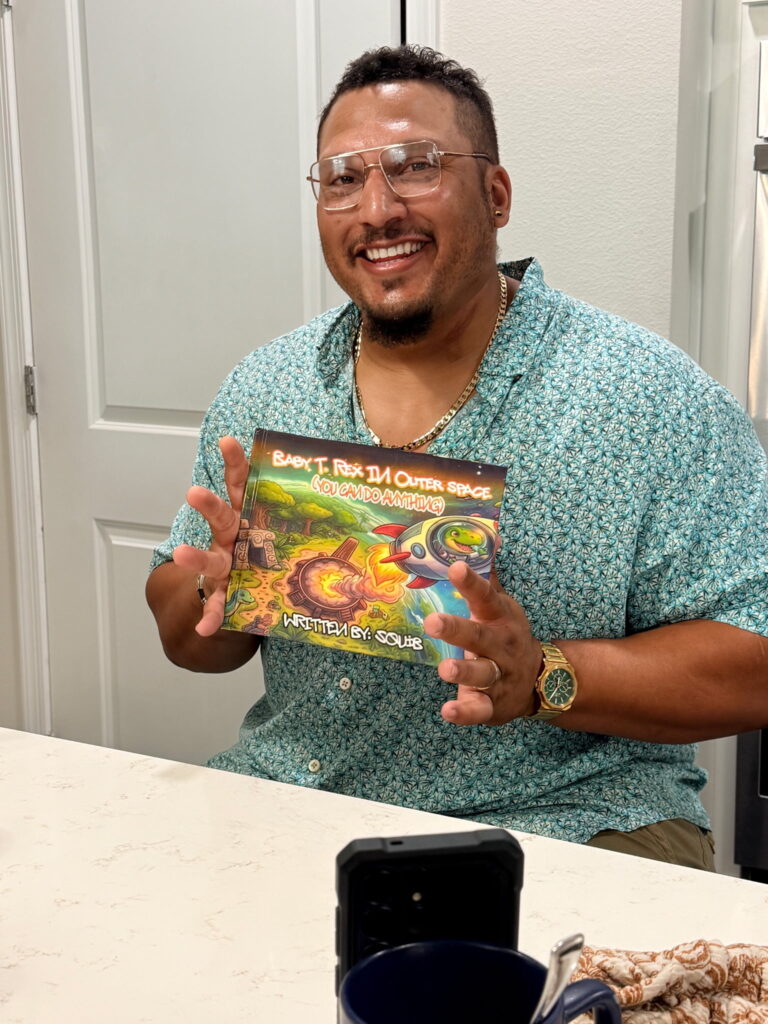 Daniel Turnage poses with his new book.