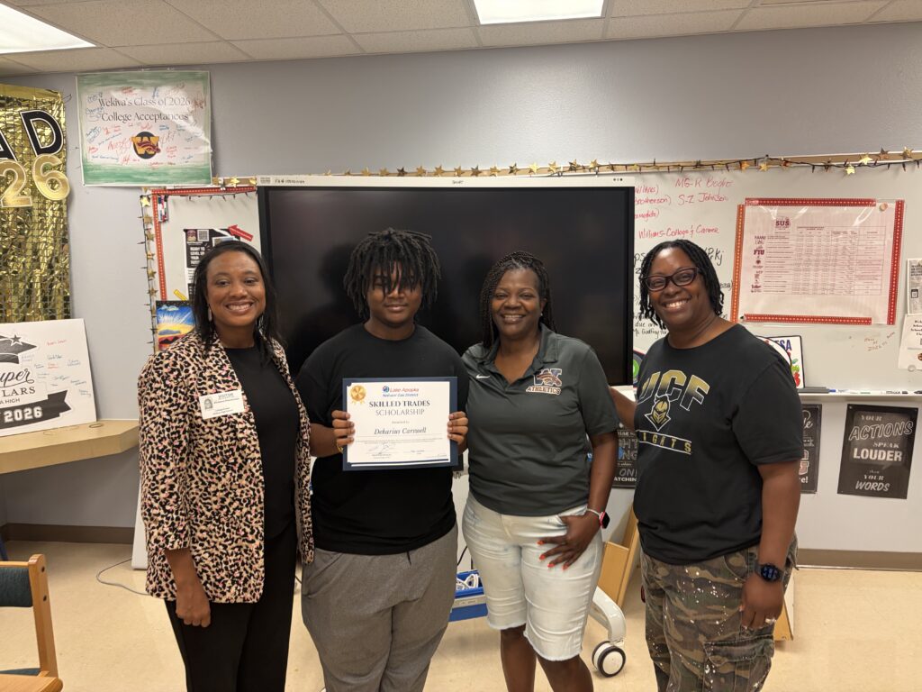 Dekarius Carswell receives his scholarship certificate.