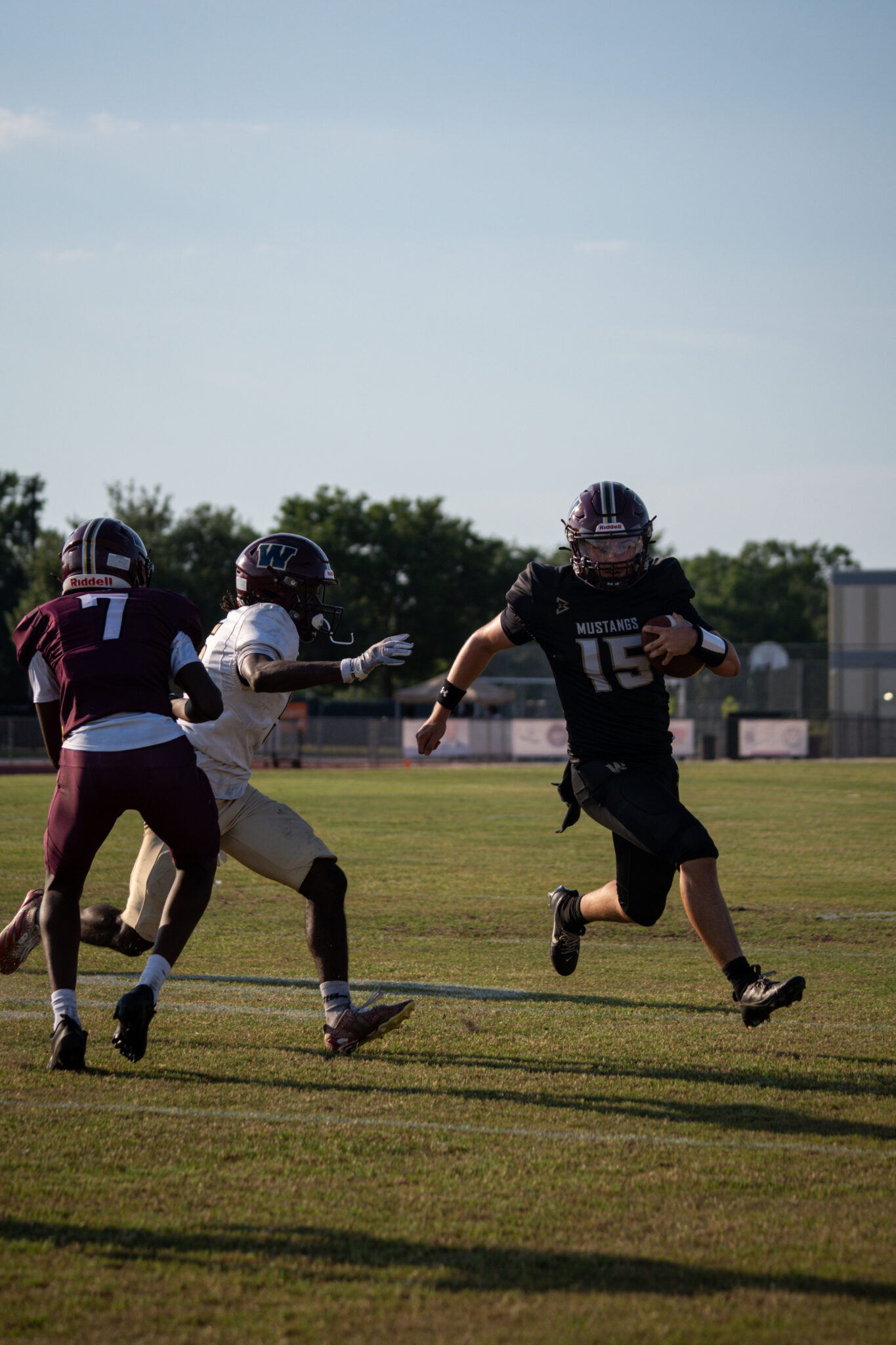 Dominick Sanguine tries to evade the defender as he cuts up the sideline.