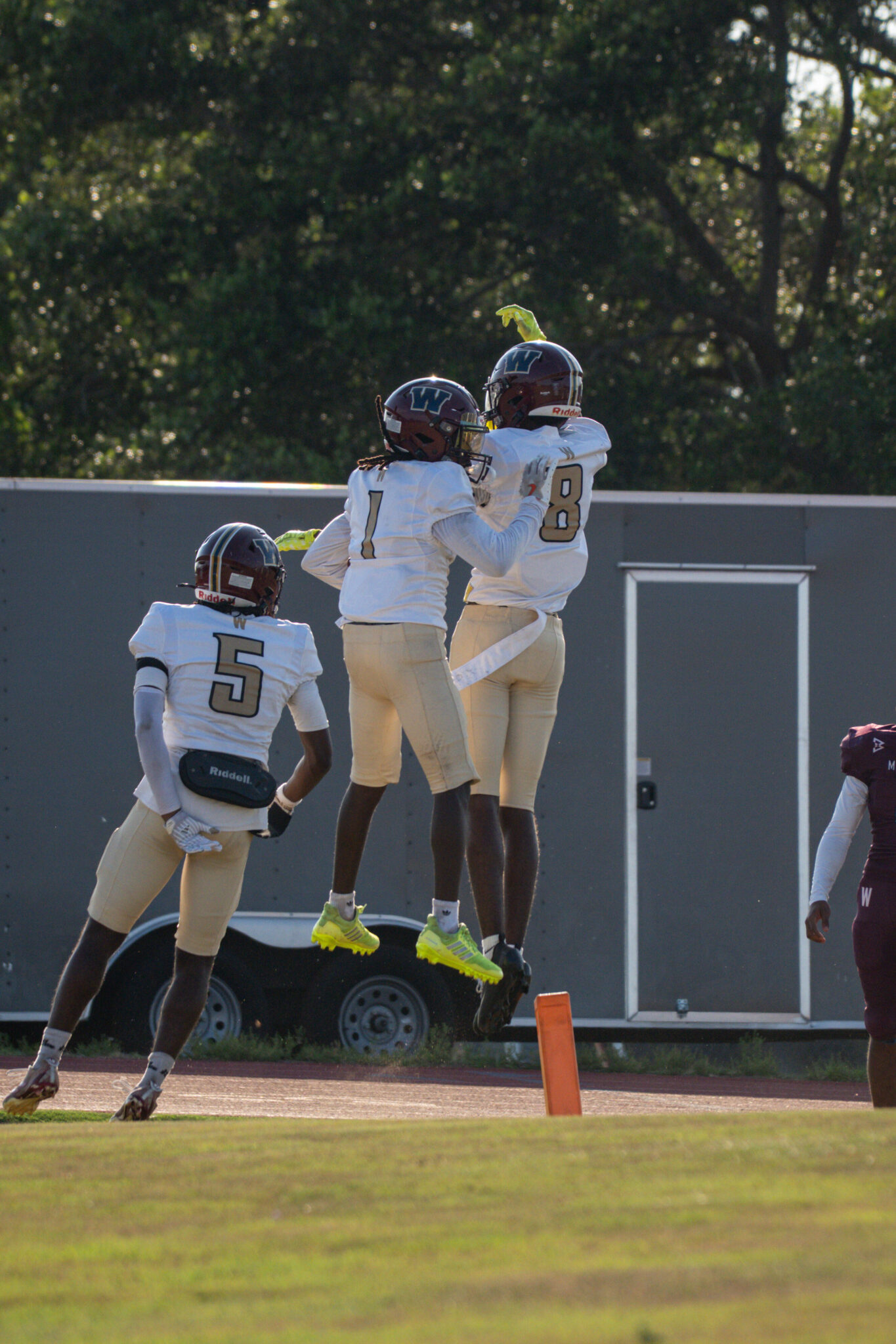 Dominique Walker (1) and Deandre Adams (8) shoulder bump in the endzone.