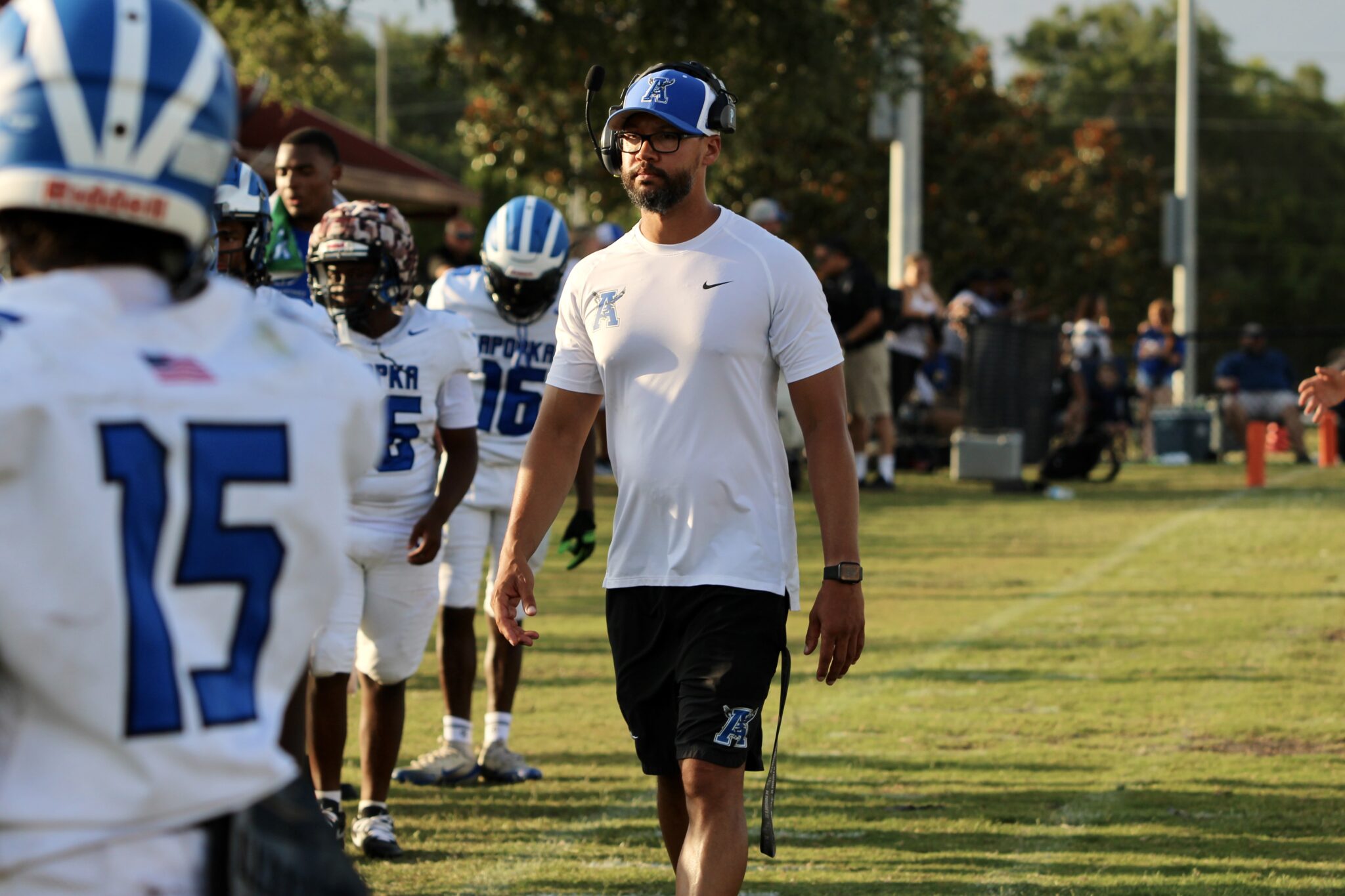 Coach Marcus Neeson on the sideline withe the White team
