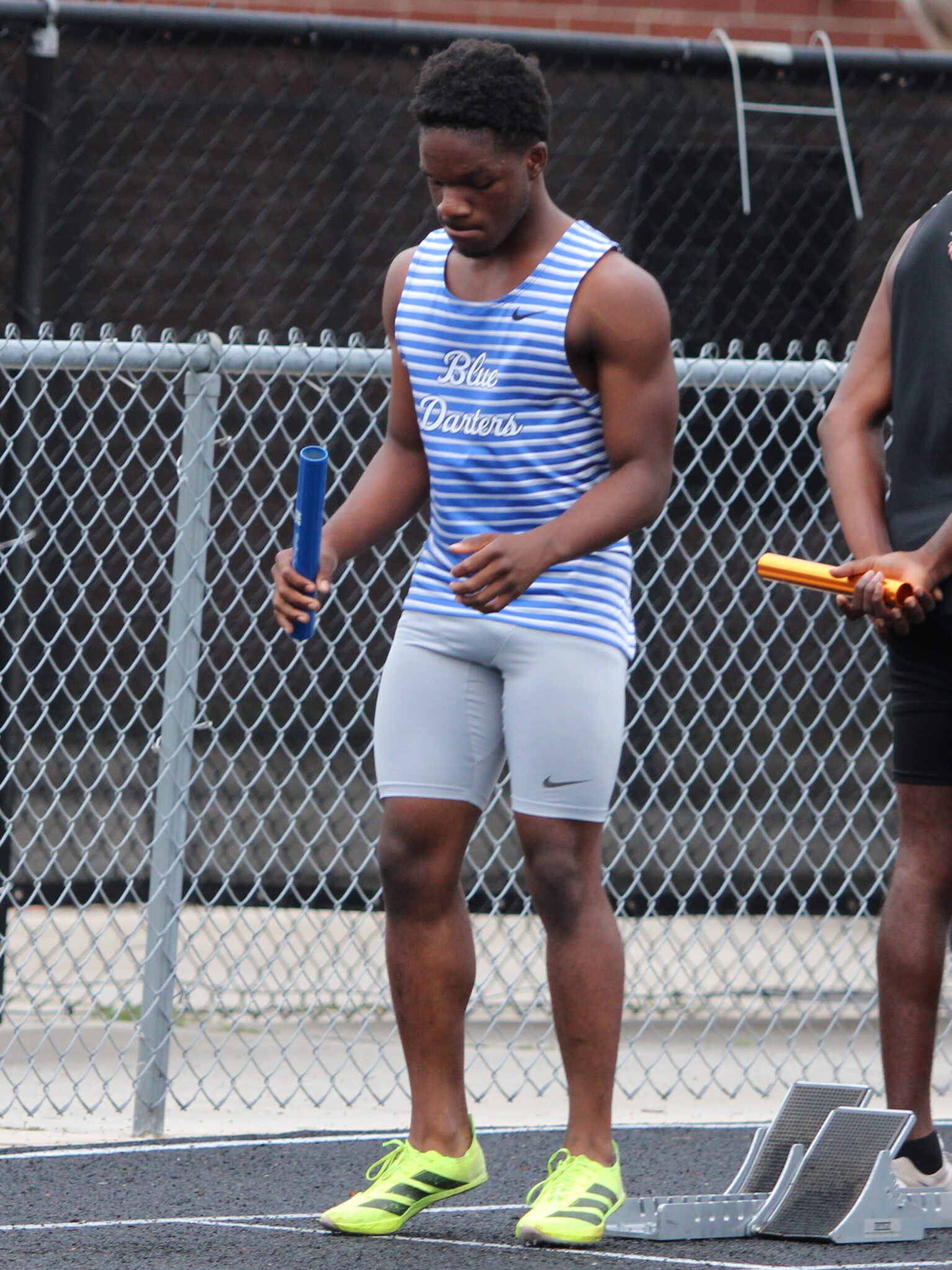 Jakyvion Kemp loads up his energy for the first leg of the boys 4x100m race.