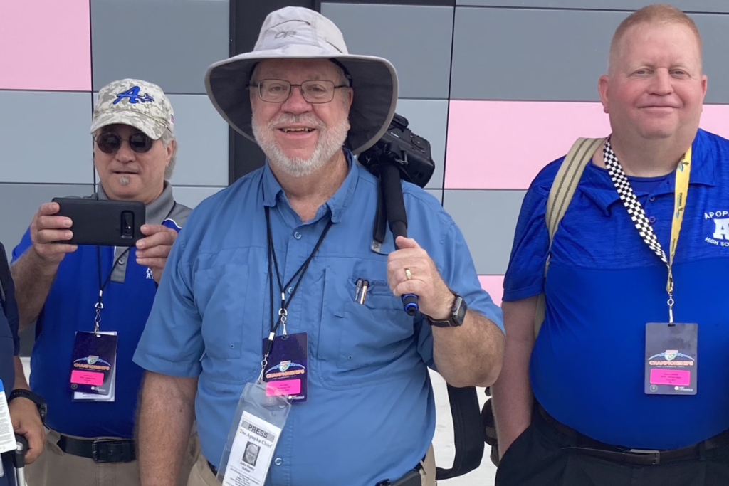 John Peery at one of Apopka football's State Championship games with broadcaster Joe Ferraro and Apopka PA Announcer Steven Schwartze. (Courtesy of Roger Williams)