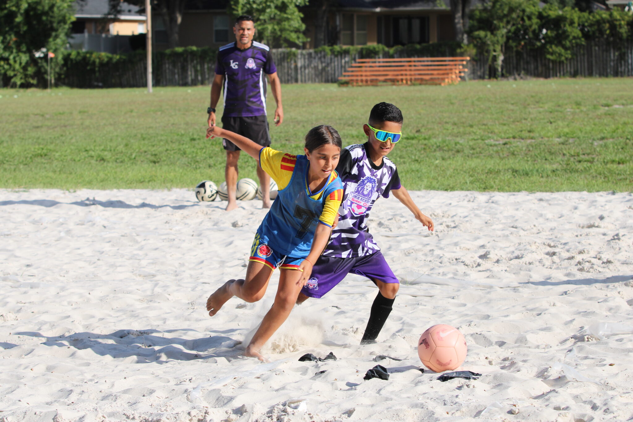 Longa Academy athletes battle one on one for the ball.