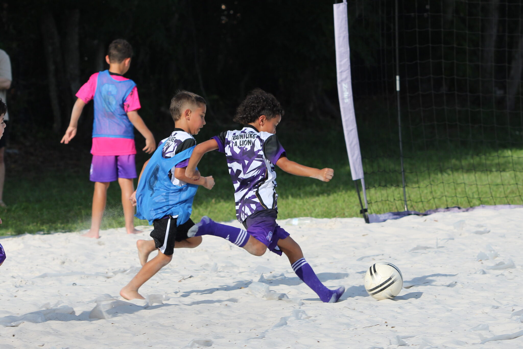 Longa Academy futures player club member blasts a shot into the goal.