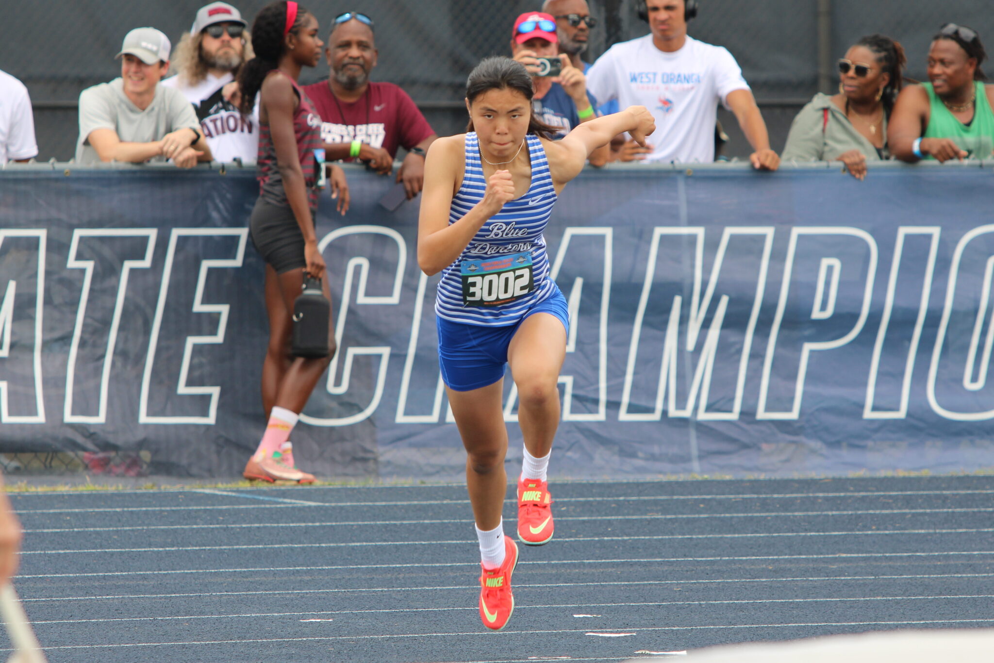 Mandy Zheng sprints forward to complete the first high jump