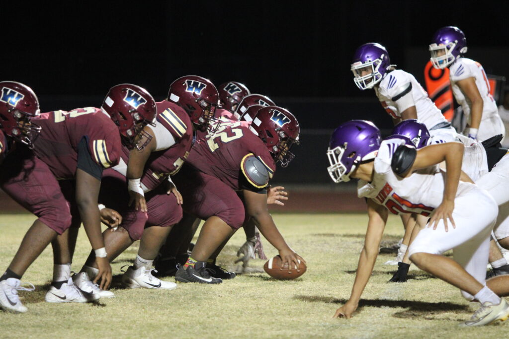 Mustangs offensive line faces off with the defensive front of the Horizon Hawks.