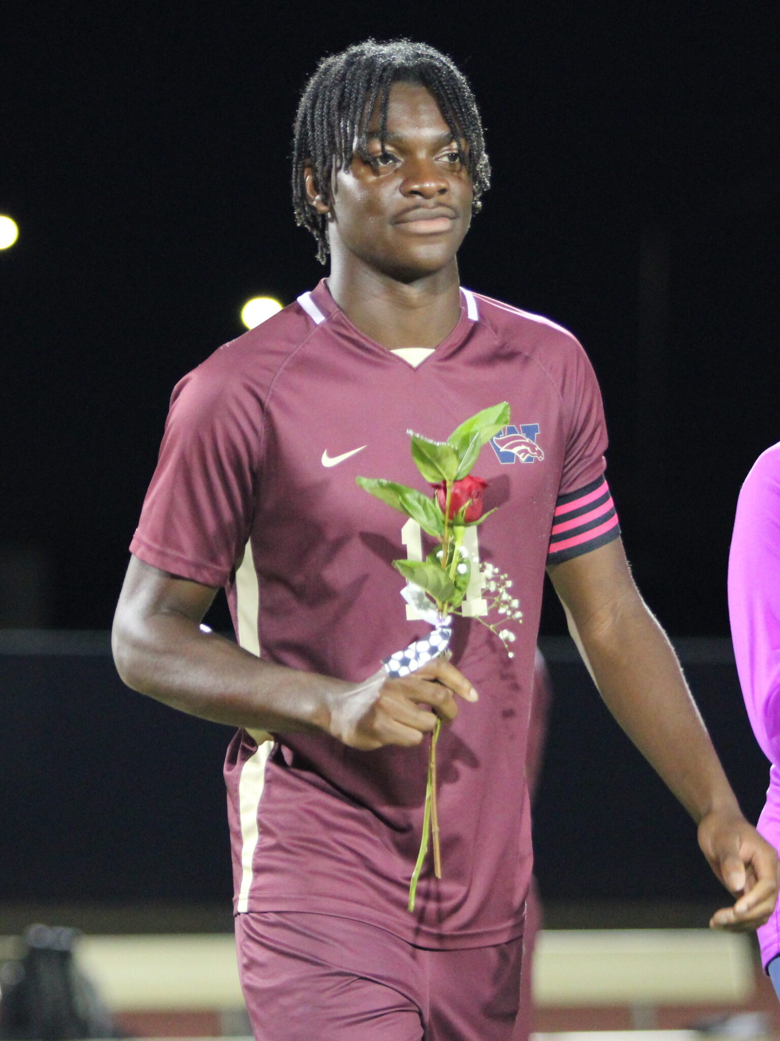 Nathaniel Ellis walks out for Senior Night