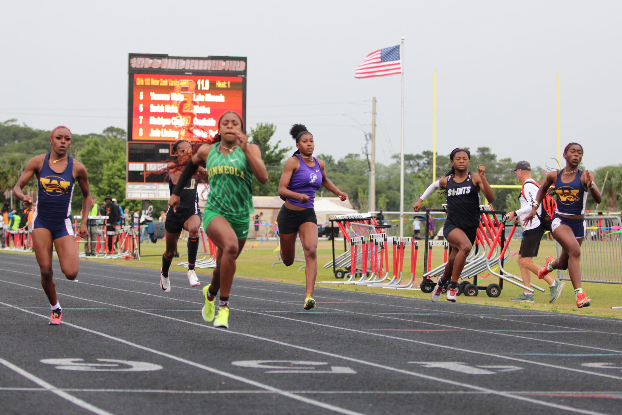 Soriah Hicks and Akira Wise slightly trail Lake Minneola in their heat.