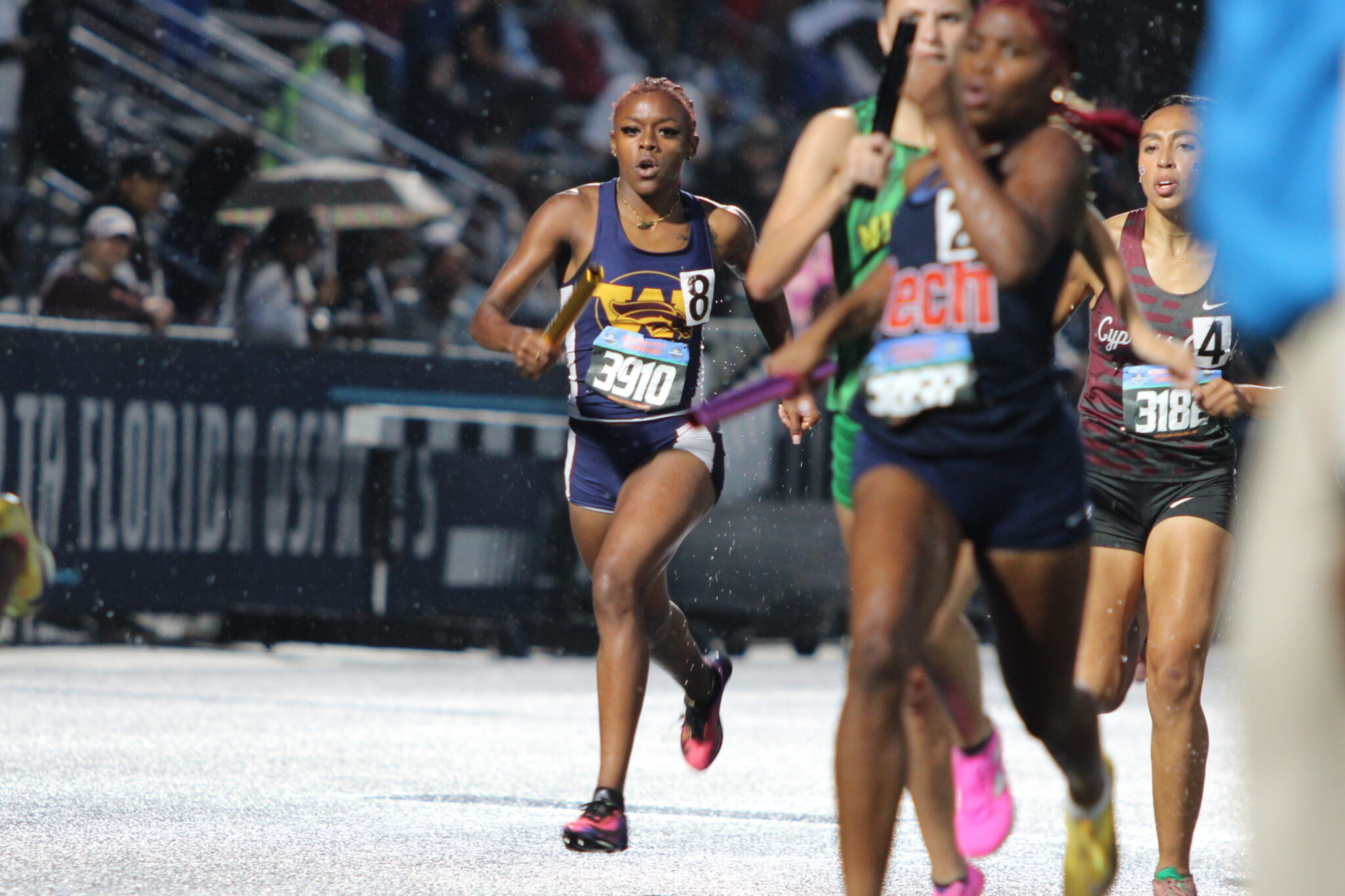 Soriah Hicks approaches the finish line to hand off the baton to Cebreeya