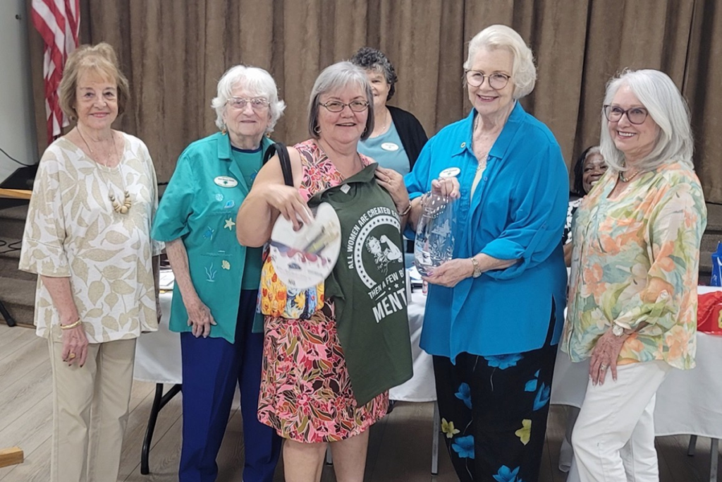 Four honorees honored Lorena Potter with the Woman of the Year distinction. From left to right_Trudy Weiss, Geri Unrue, Lorena Potter, Bev Winesburgh and Bobbie Dougherty, with club president Diane Harrison in the background.