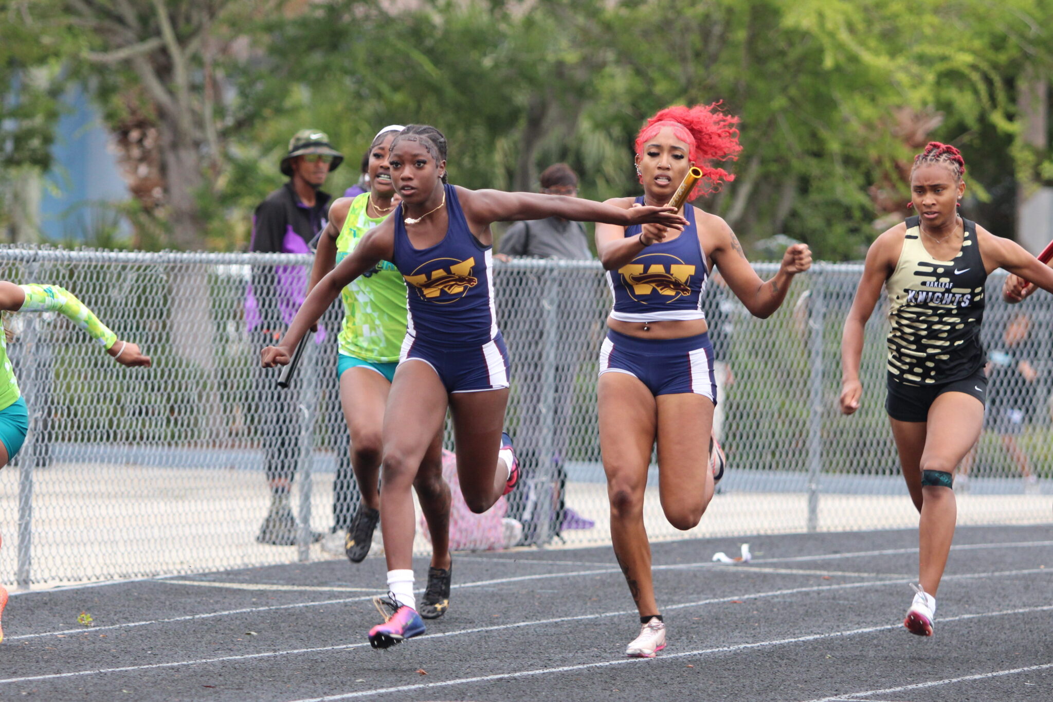 Xia Scott hands the baton to Te'Ariel Harley for the second 100 of the relay
