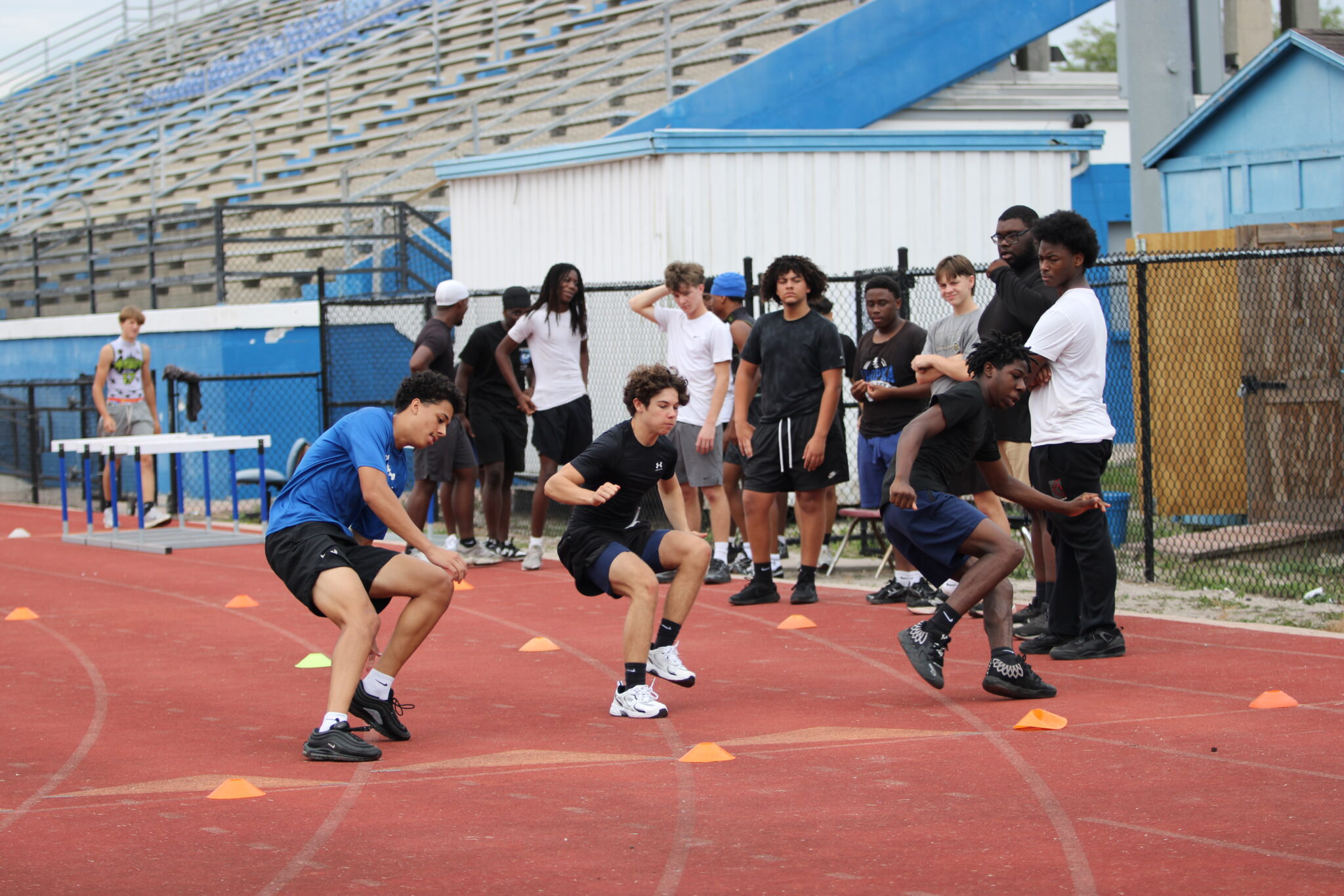 Coach Kelvin 'Big Baby' Joyner drilling the second group in agility.