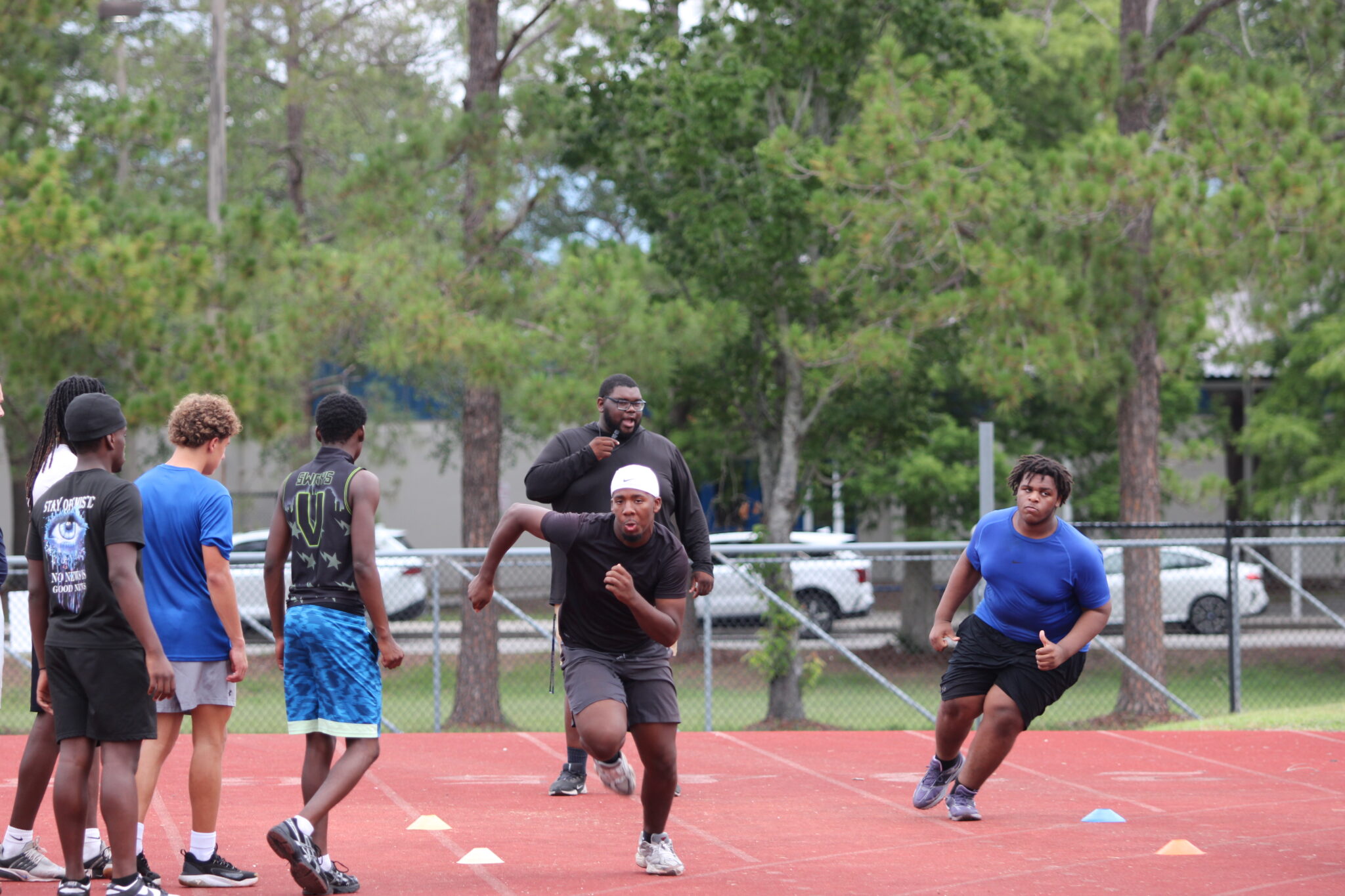 Coach Kelvin 'Big Baby' Joyner runs agility training with the second group.